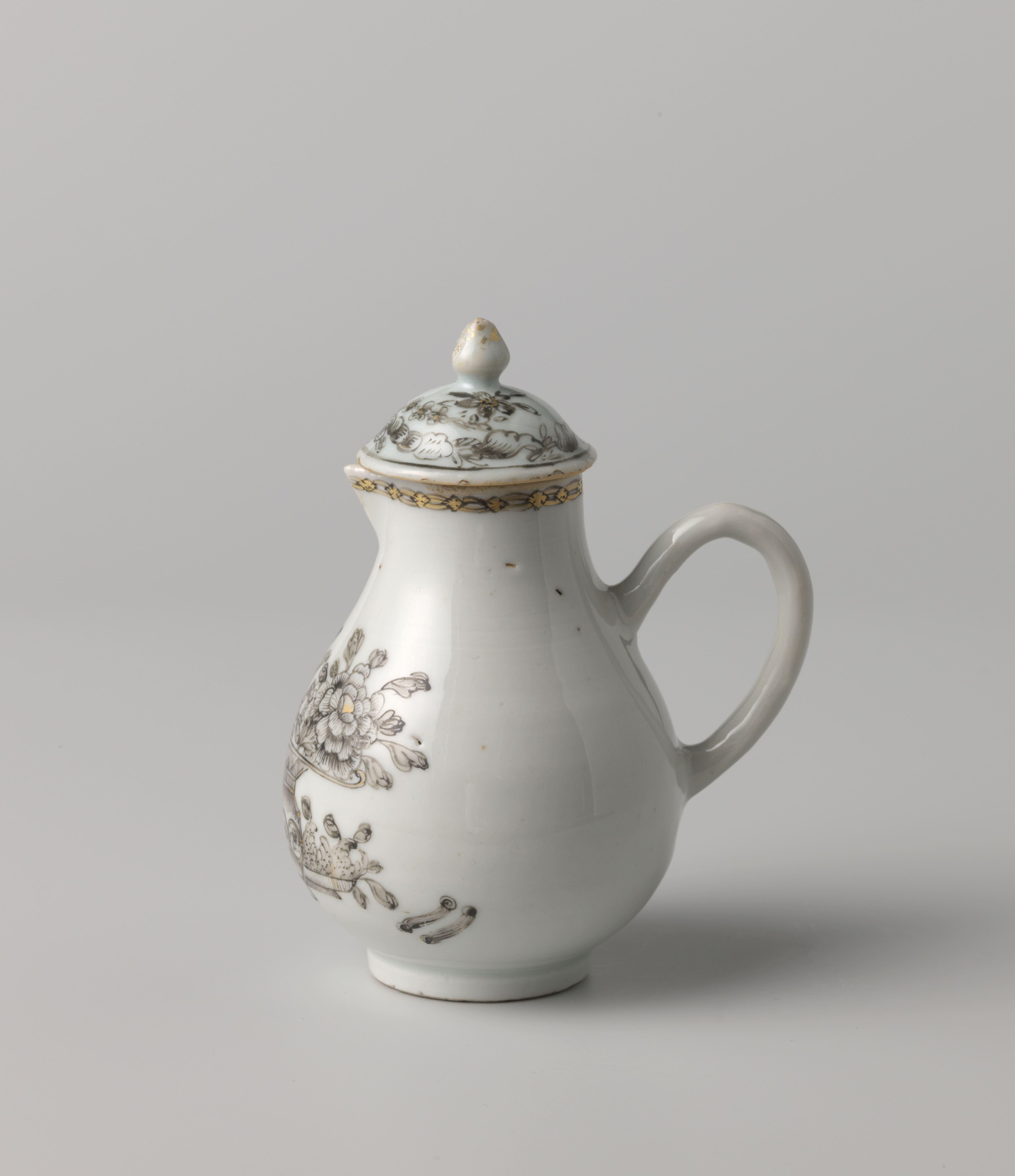 Pear-shaped milk jug with a flower and fruit basket