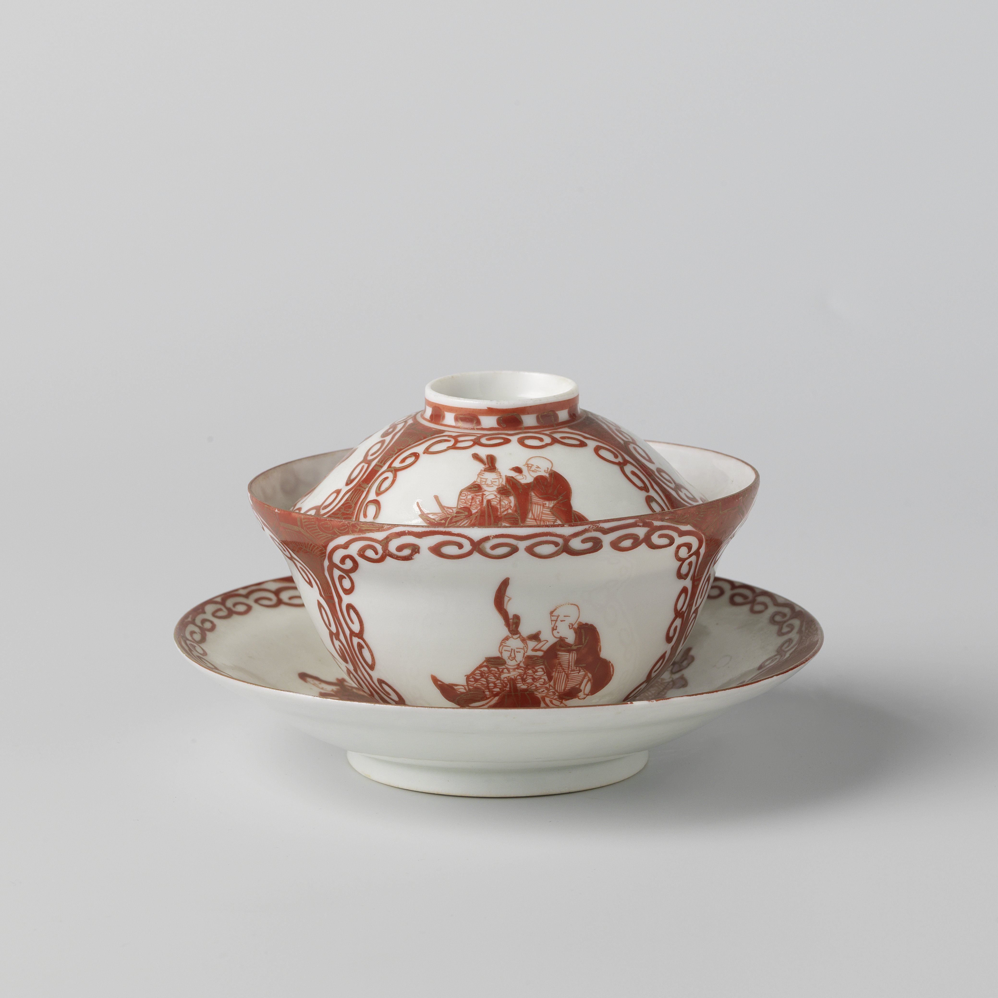 Covered cup and saucer with three panels with two seated figures
