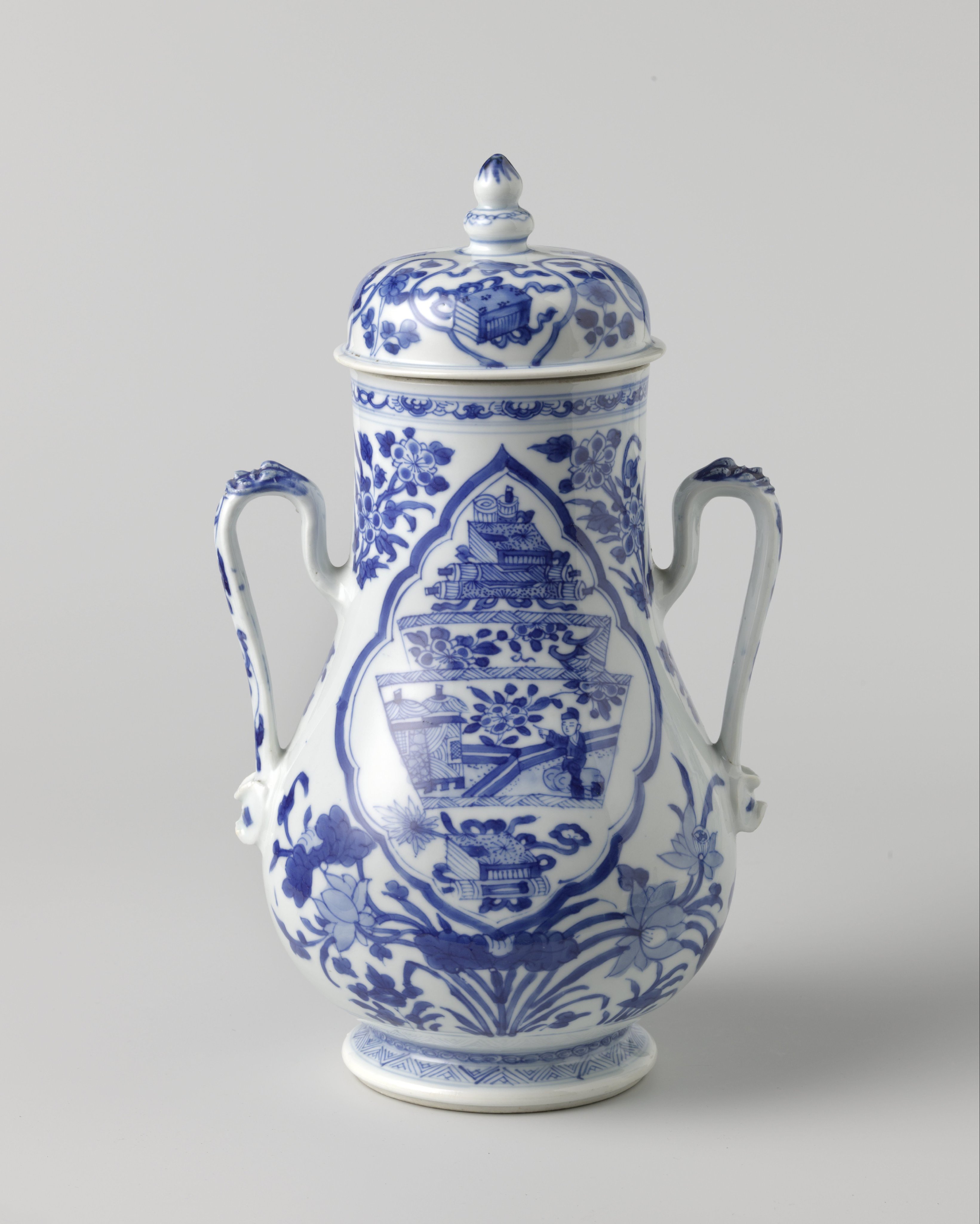 Pear-shaped covered jar with precious objects and flower sprays