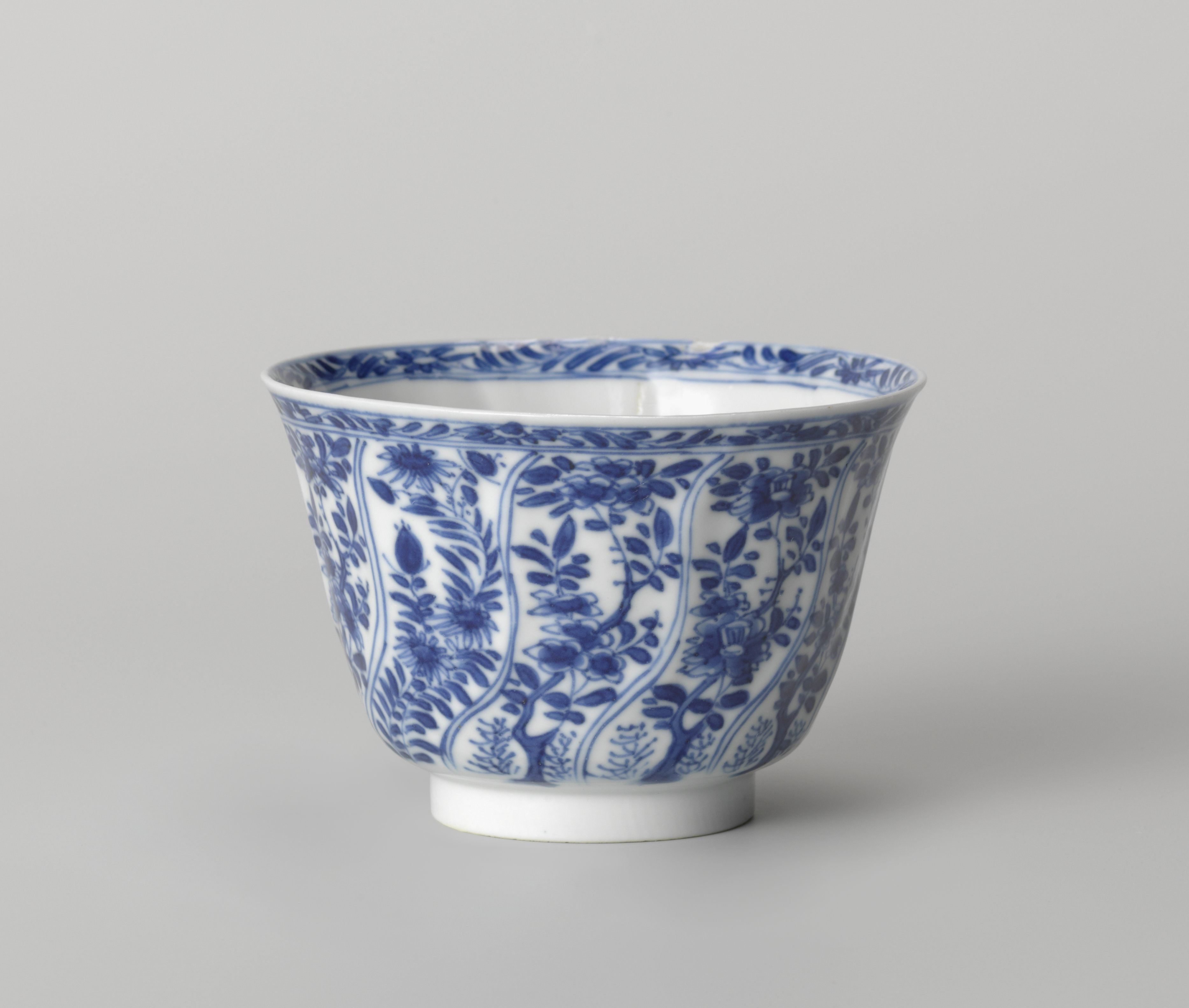 Cup with twisted panels with flower sprays