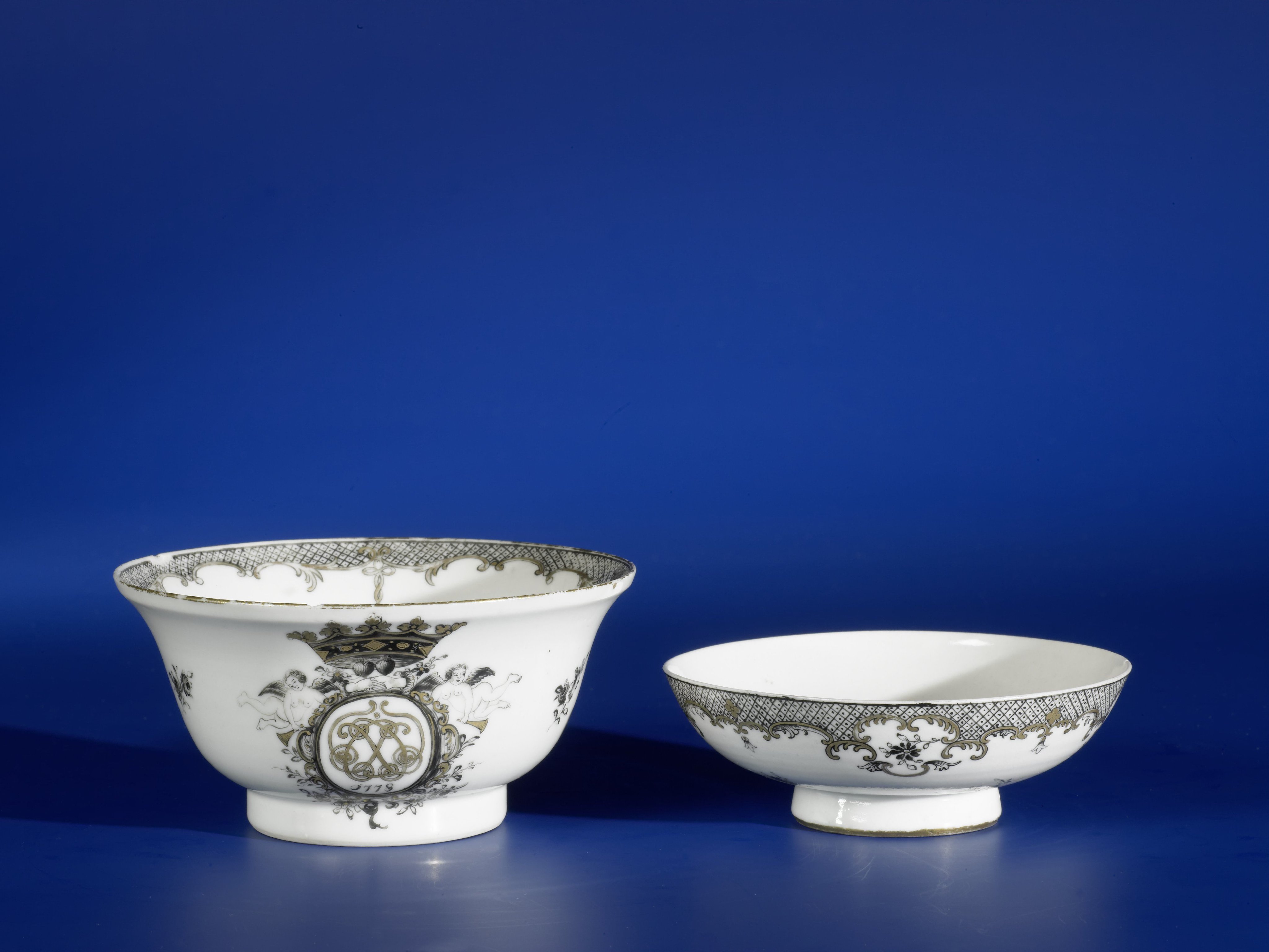 Covered bell-shaped bowl with a monogram in a richly adorned panel