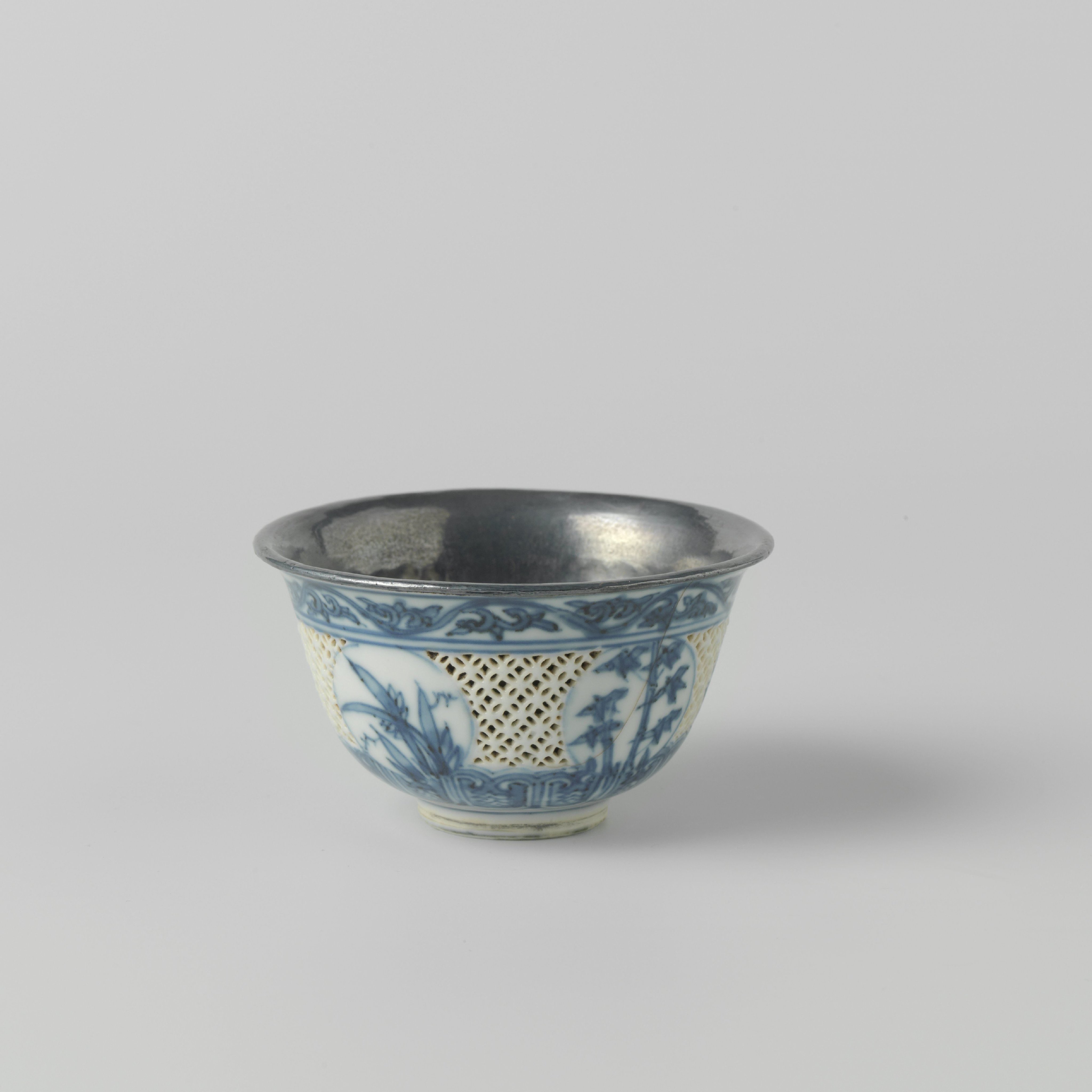 Bowl with insiced sides, flowering plants and silver mounts
