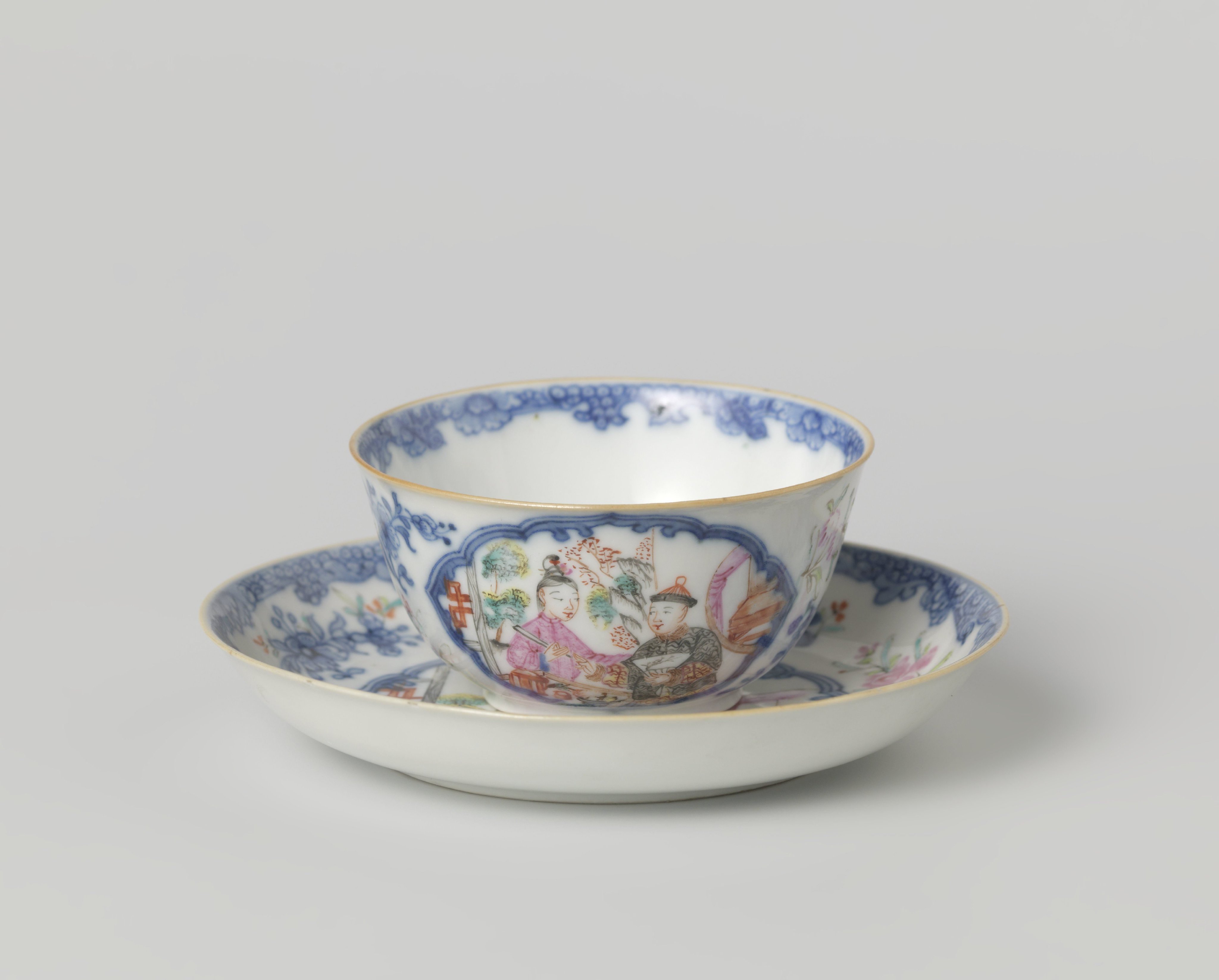 Bell-shaped cup and saucer with two figures in front of a pavilion and flower sprays