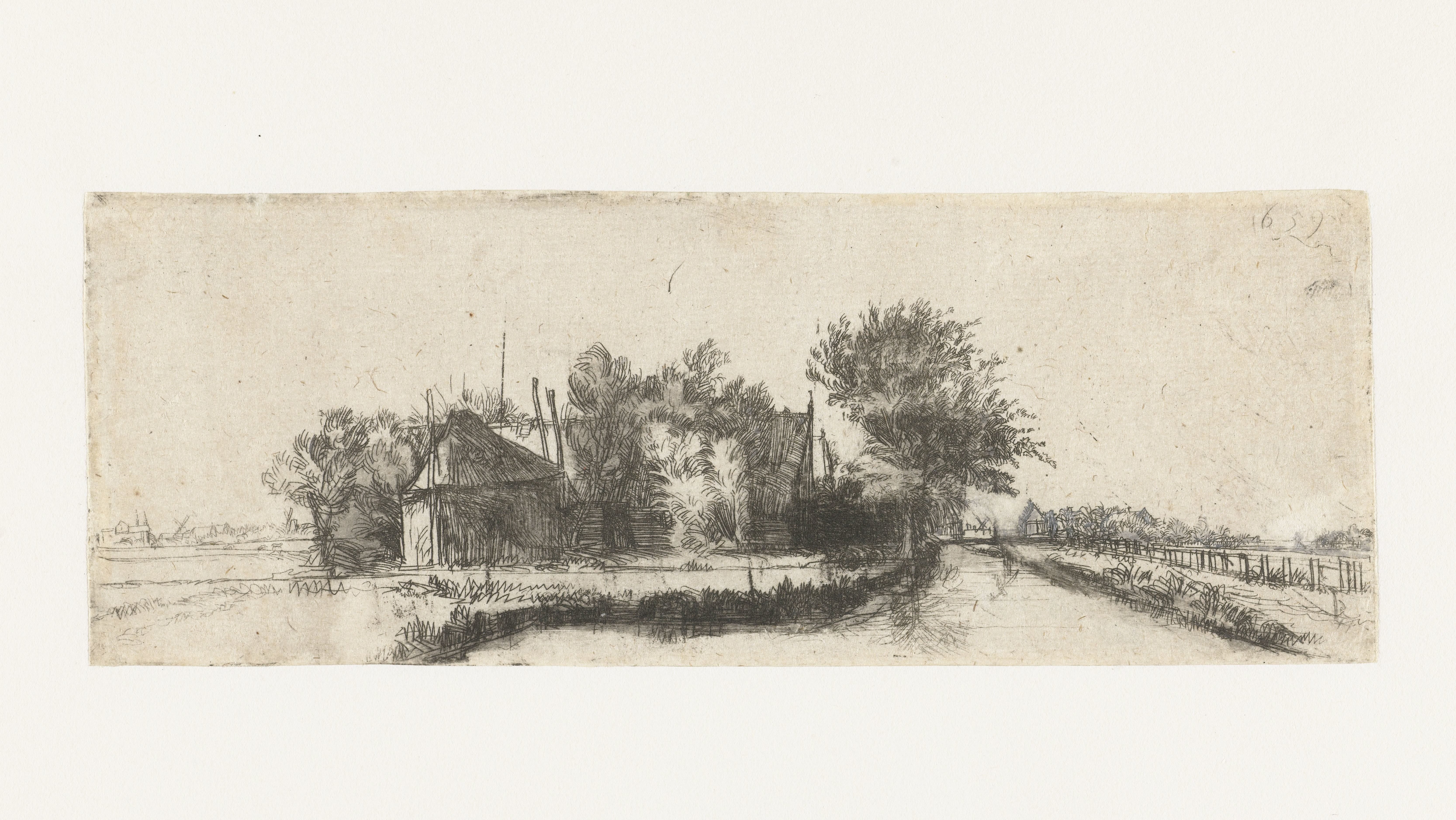 Landschap met een kanaal en hek