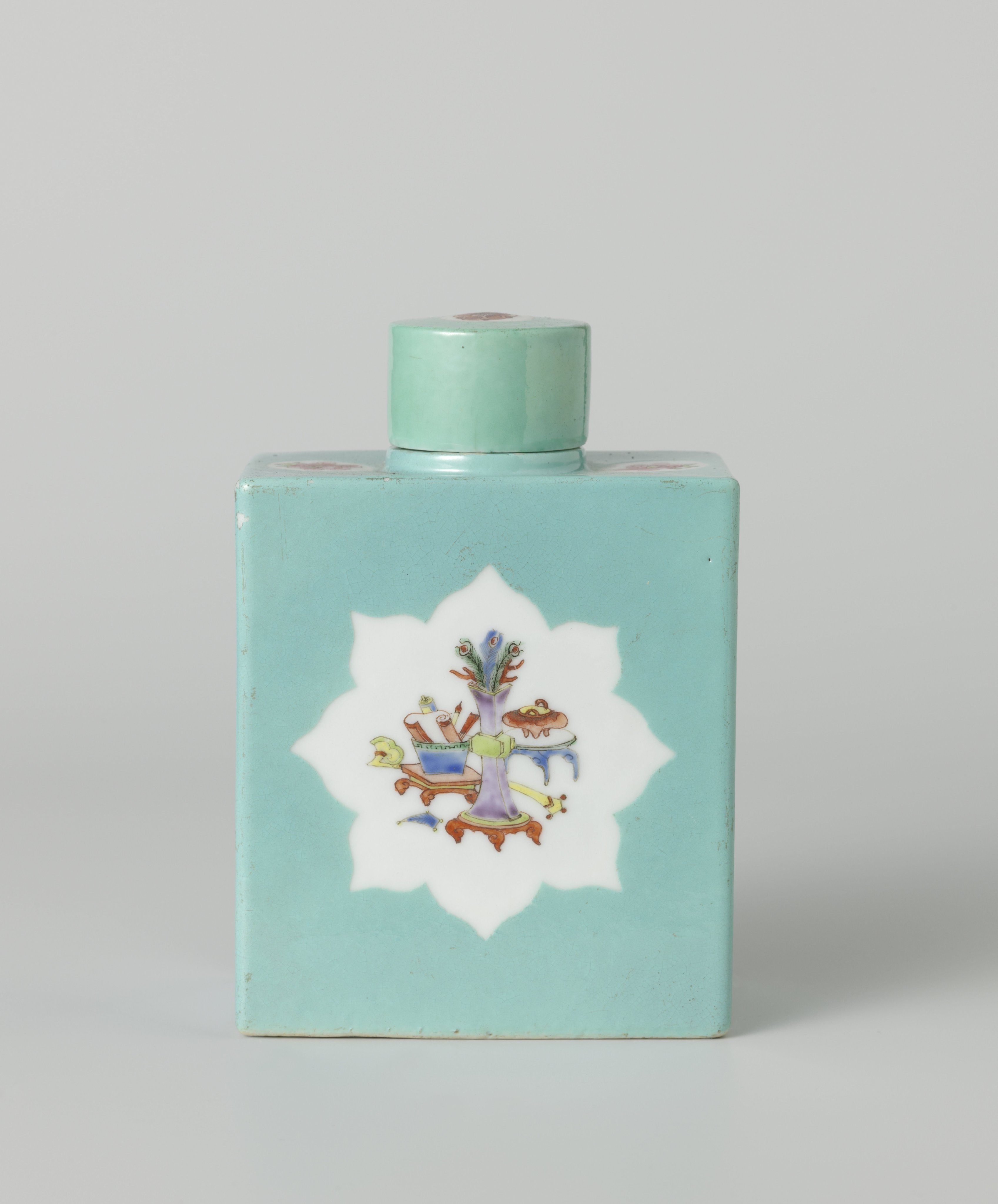 Rectangular tea caddy covered with a light blue glaze and antiquities in panels