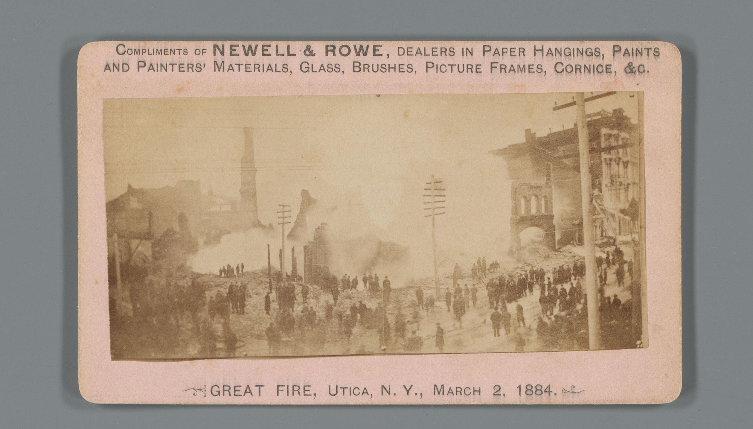 Gezicht op de brand in Utica, New York, op 2 maart 1884 als reclame voor Newell & Rowe bouwmaterialen