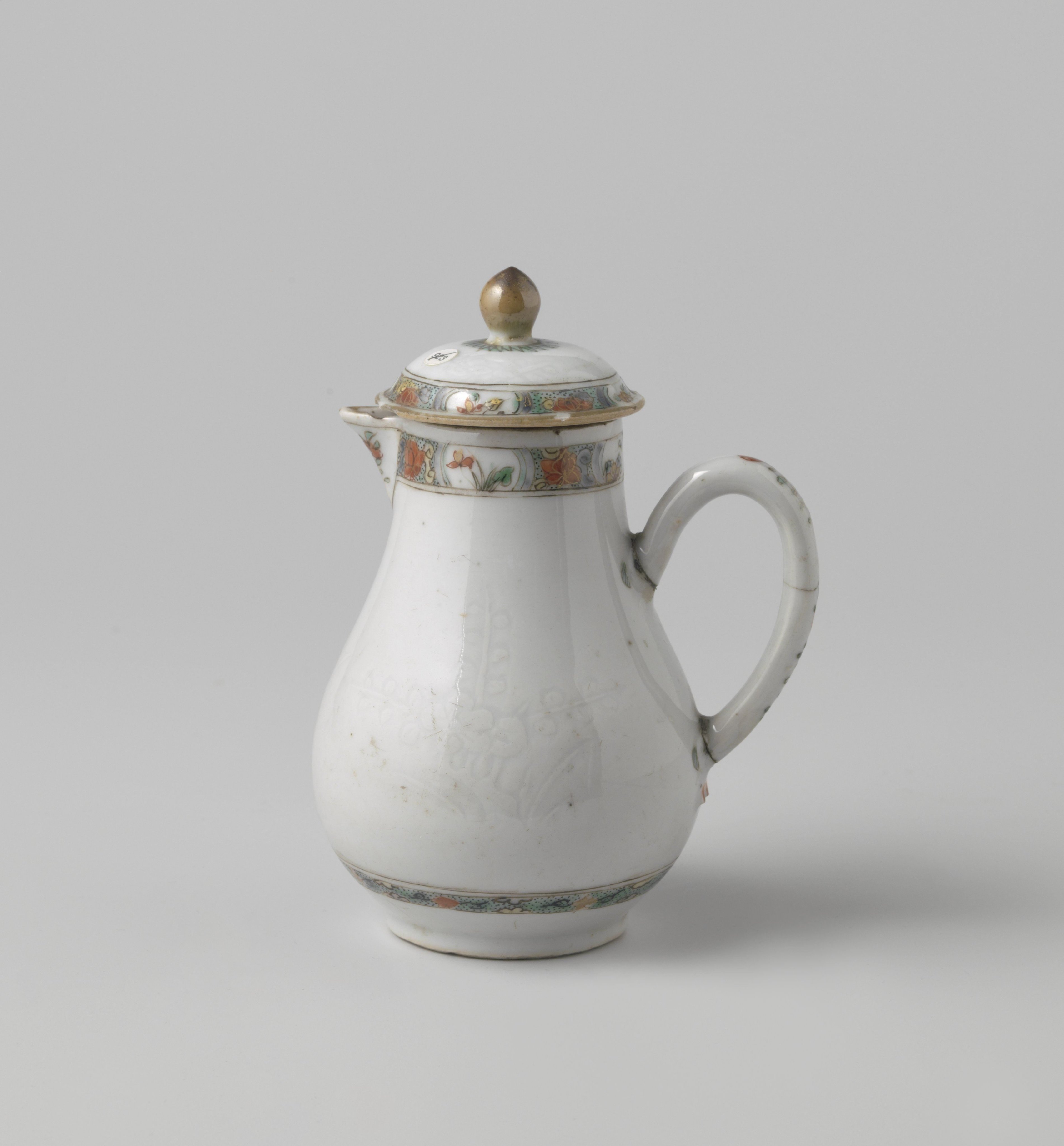 Milk jug with cover with onderglaze relief decoration with flowers
