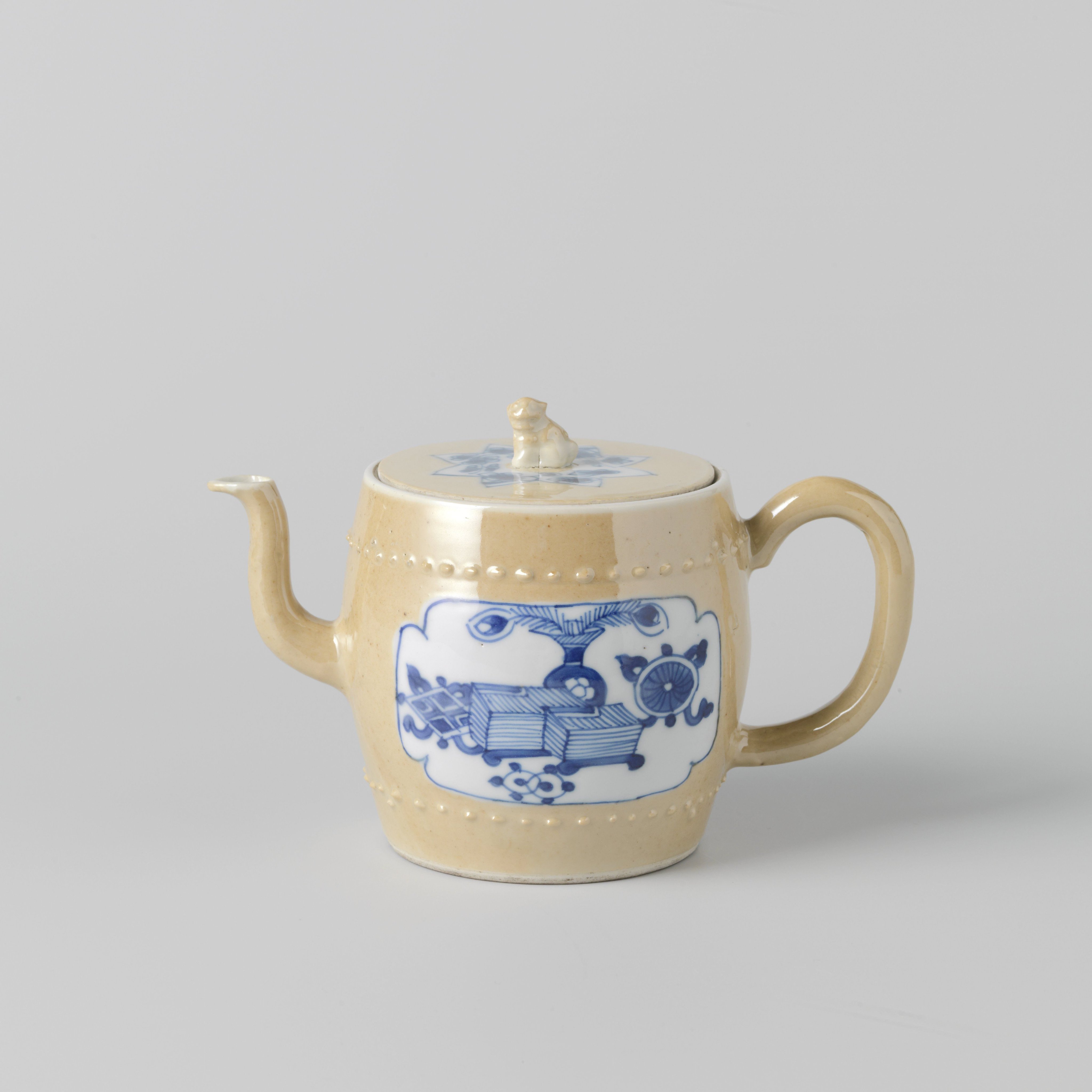 Teapot with light brown, flowering plants and antiquities