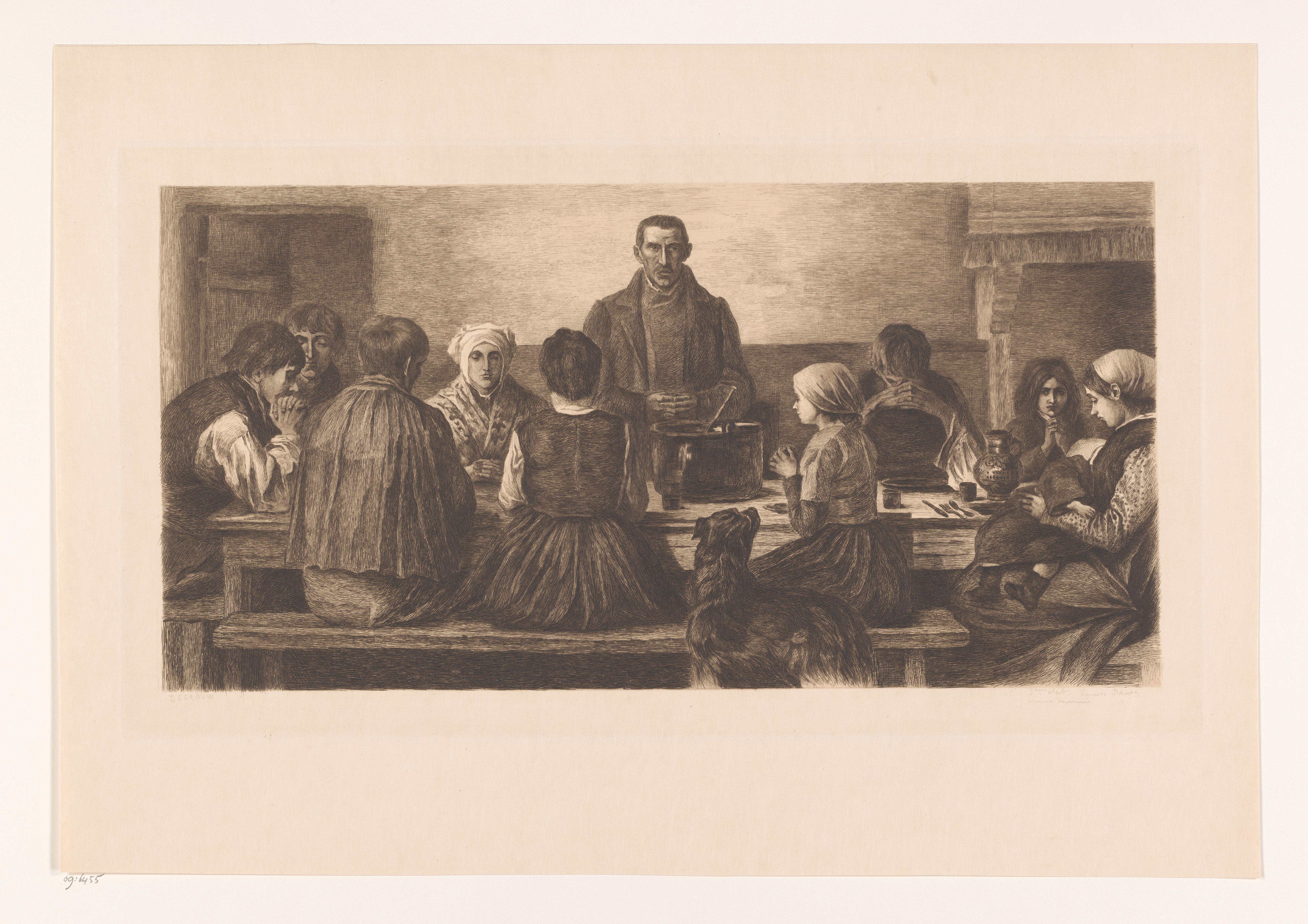 Gezin aan tafel bidt voor de maaltijd
