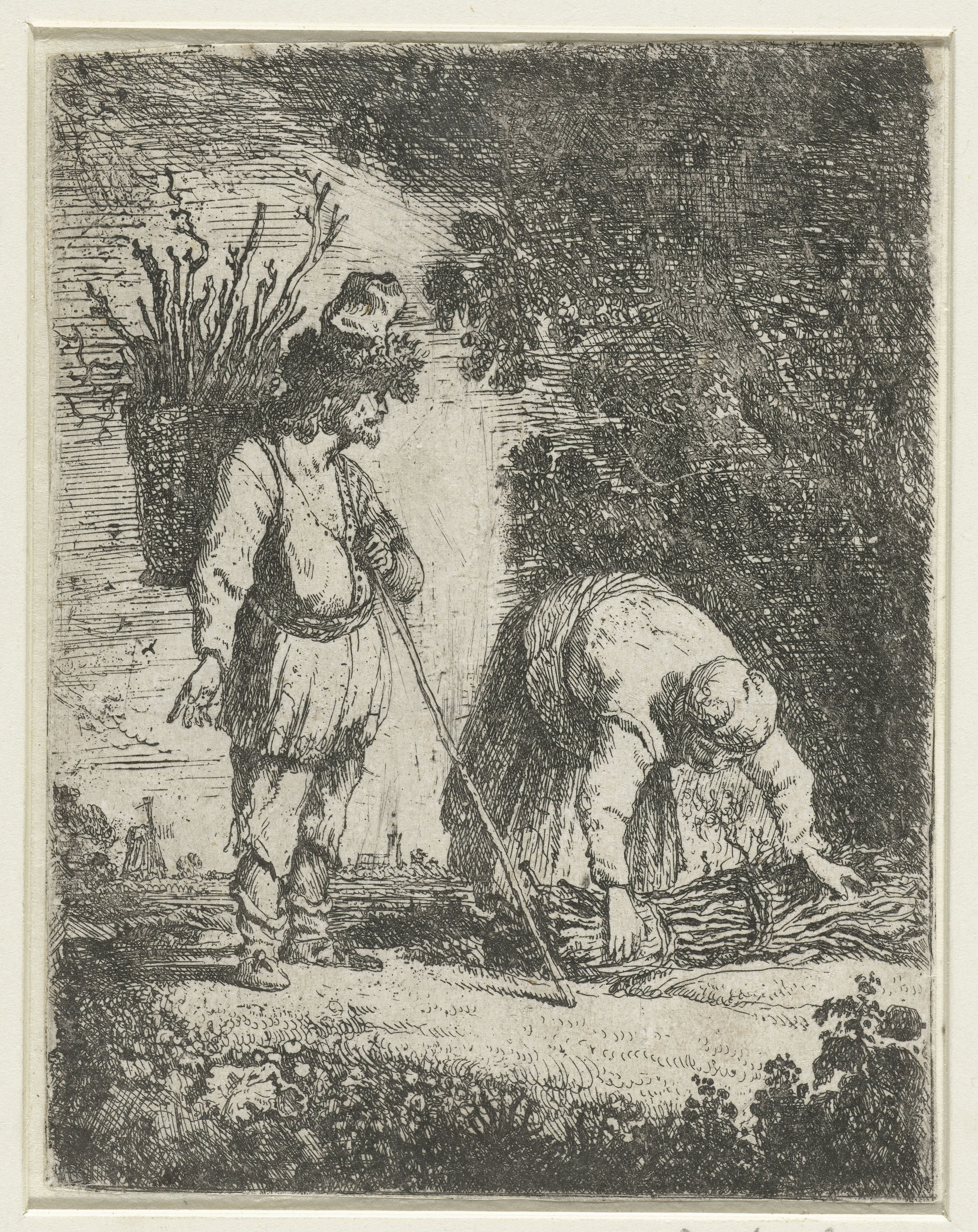 Man en een vrouw sprokkelen hout