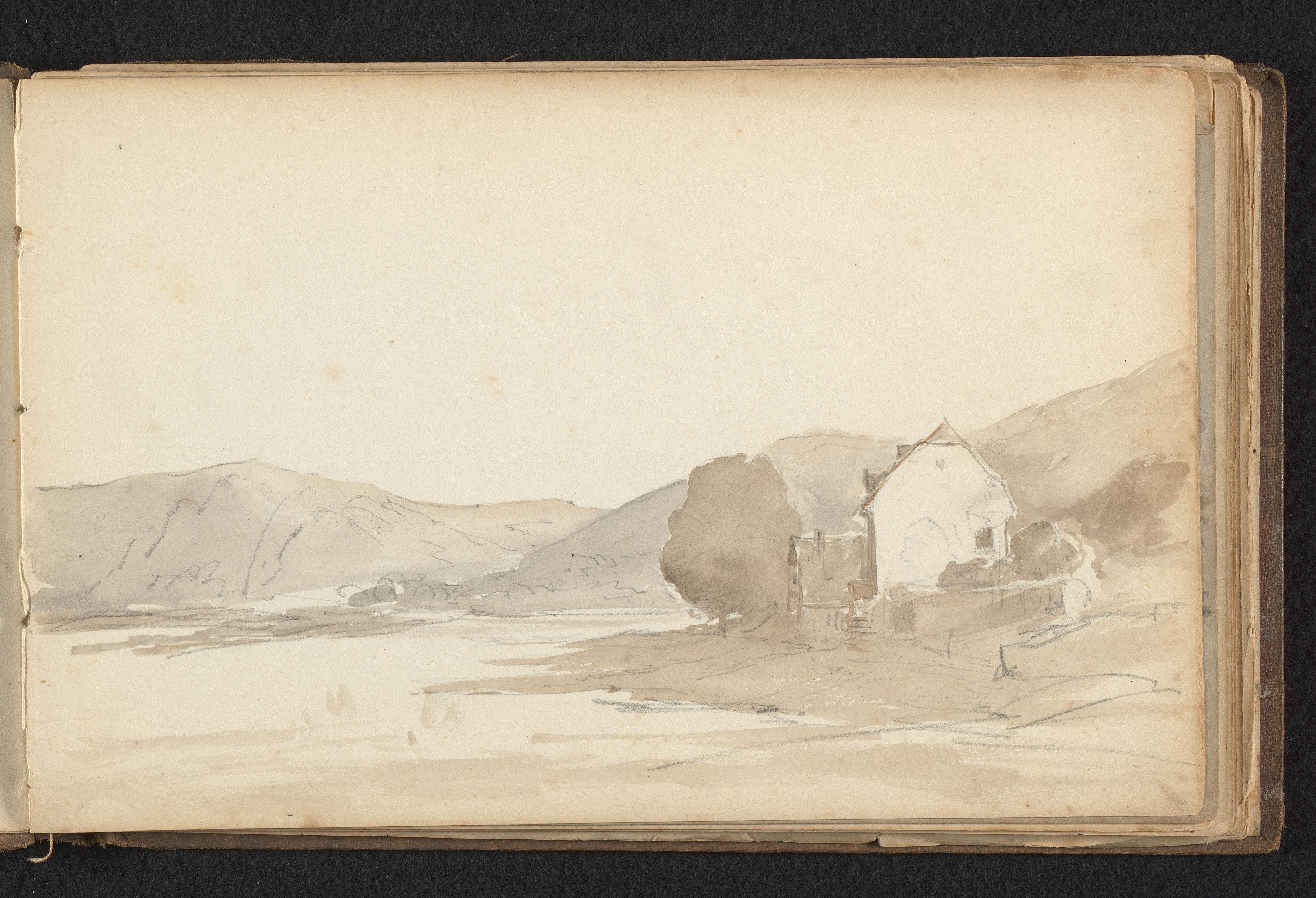 Heuvelig landschap met huis