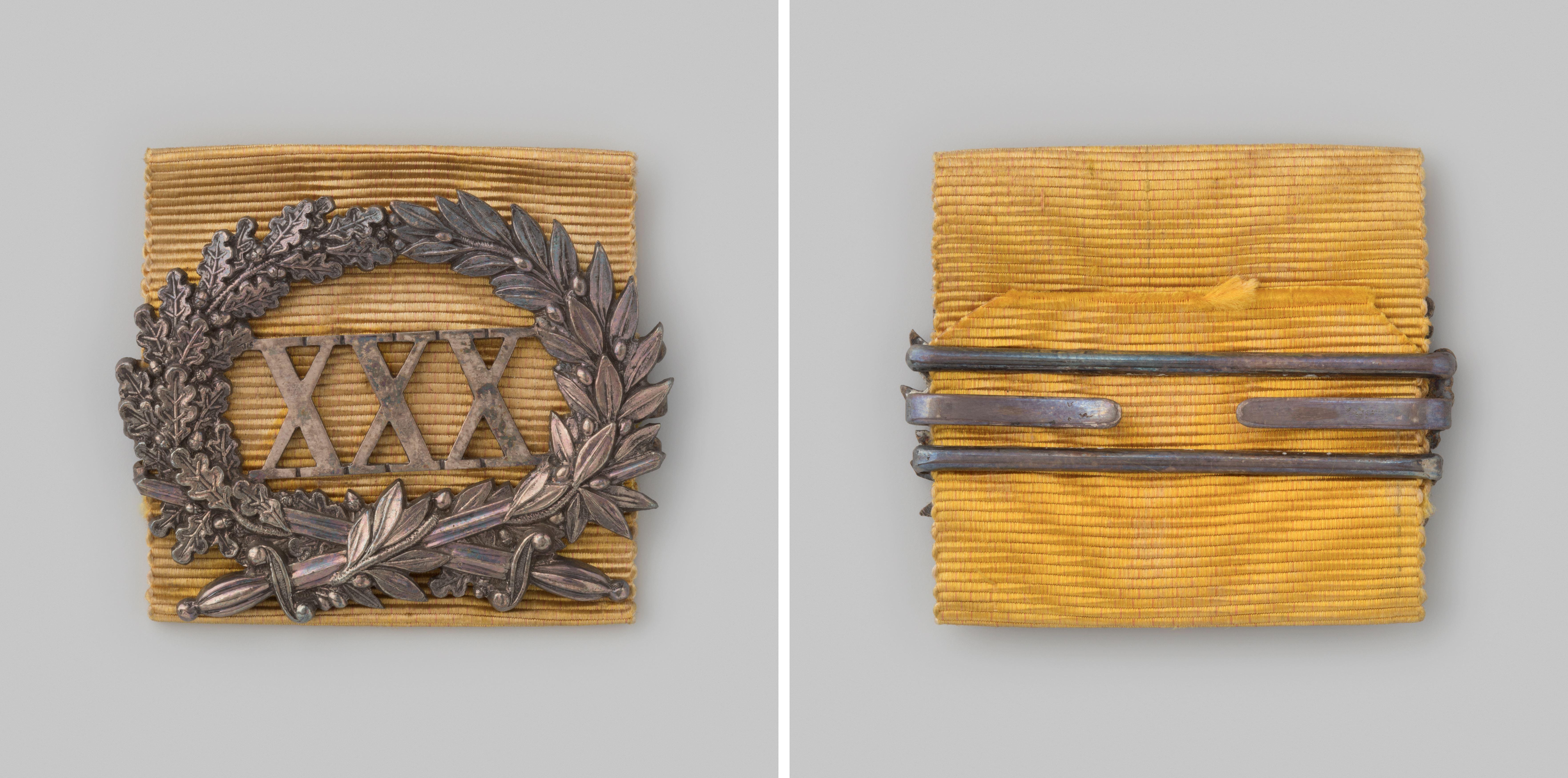 Ereteken (gesp) voor dertig jaar eervolle, langdurige en werkelijke dienst bij de schutterij als officier, gedragen door jhr. D. Bicker, kolonel-commandant te Amsterdam