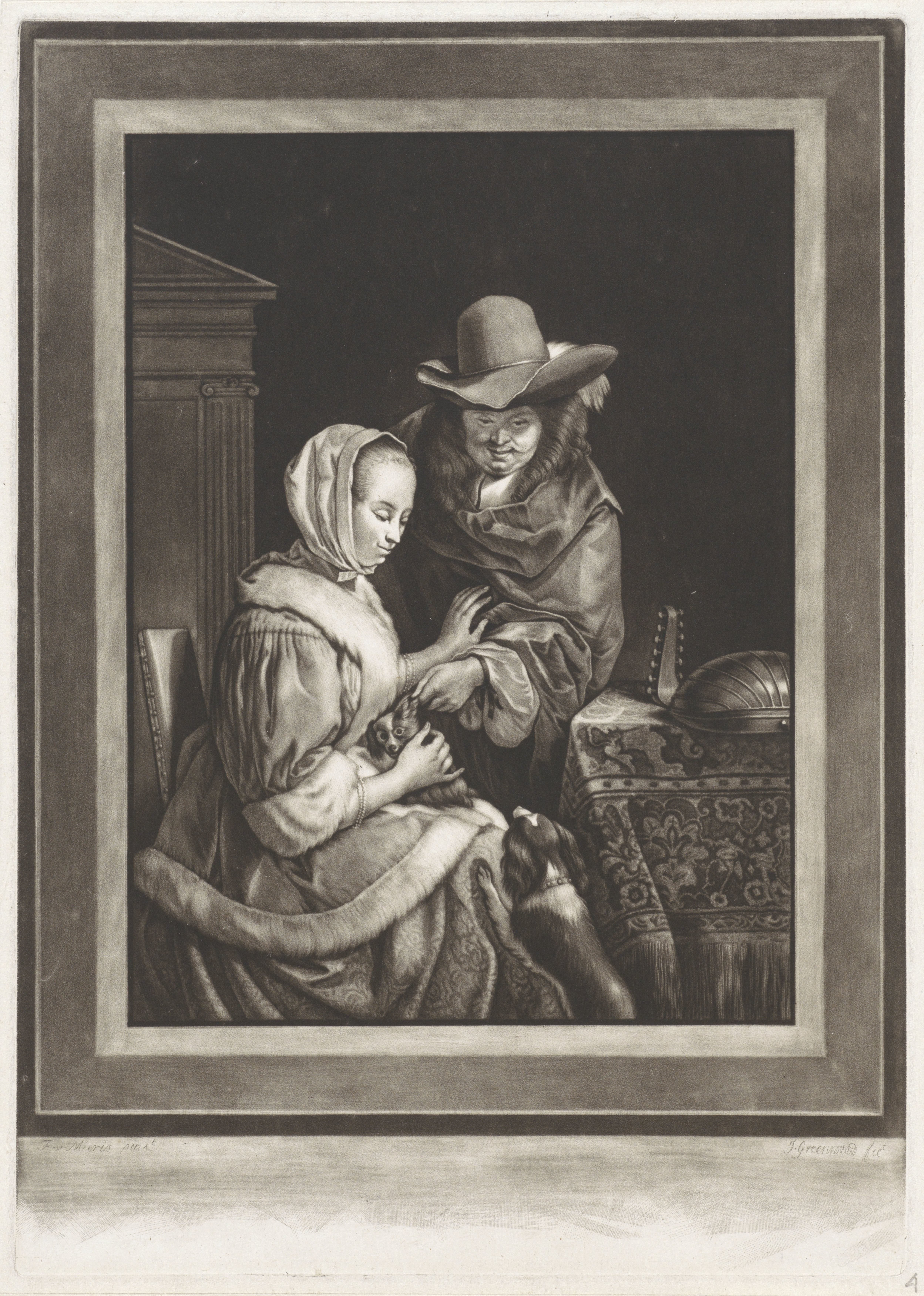 Een man en een vrouw met twee honden