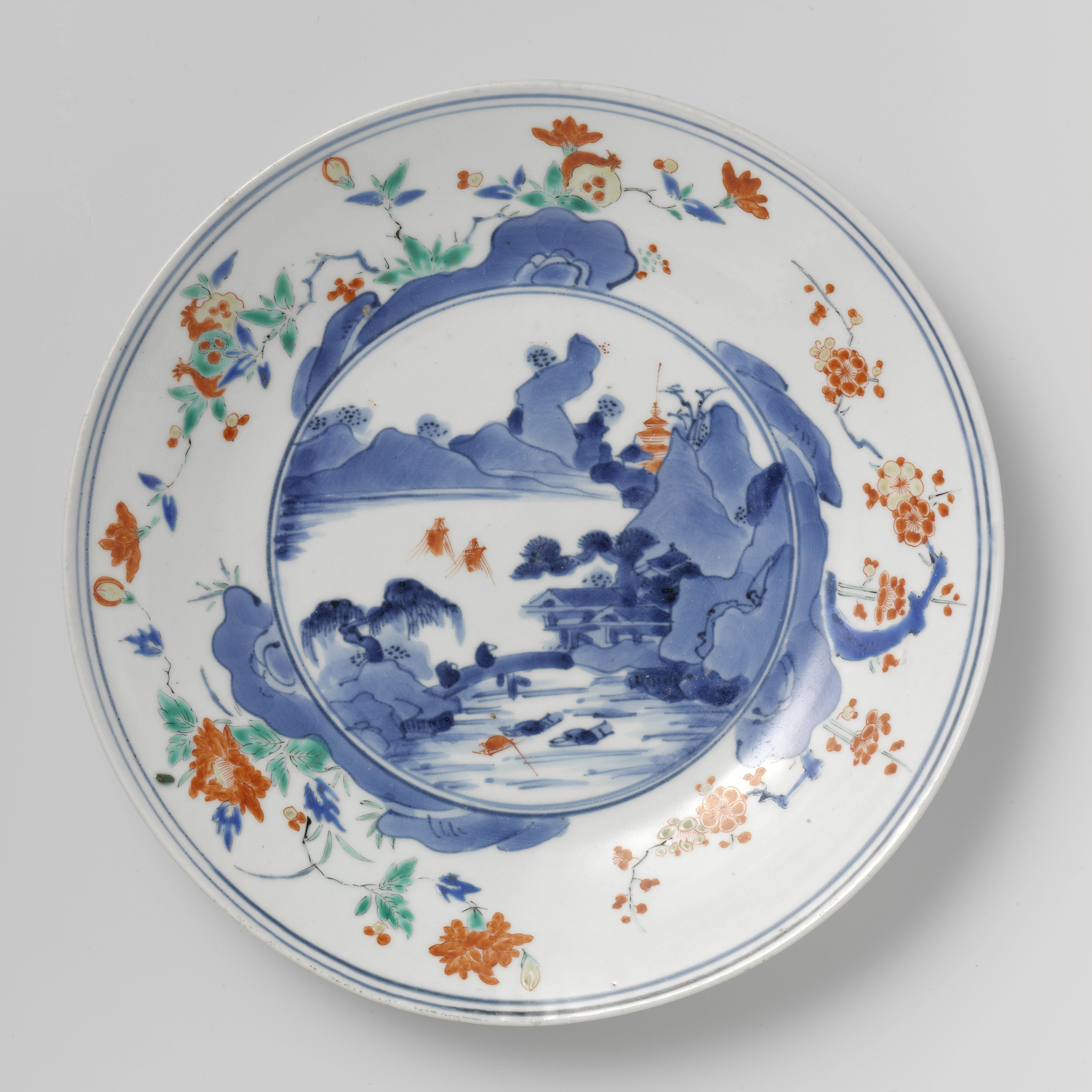 Plate with a water landscape and flowering plants