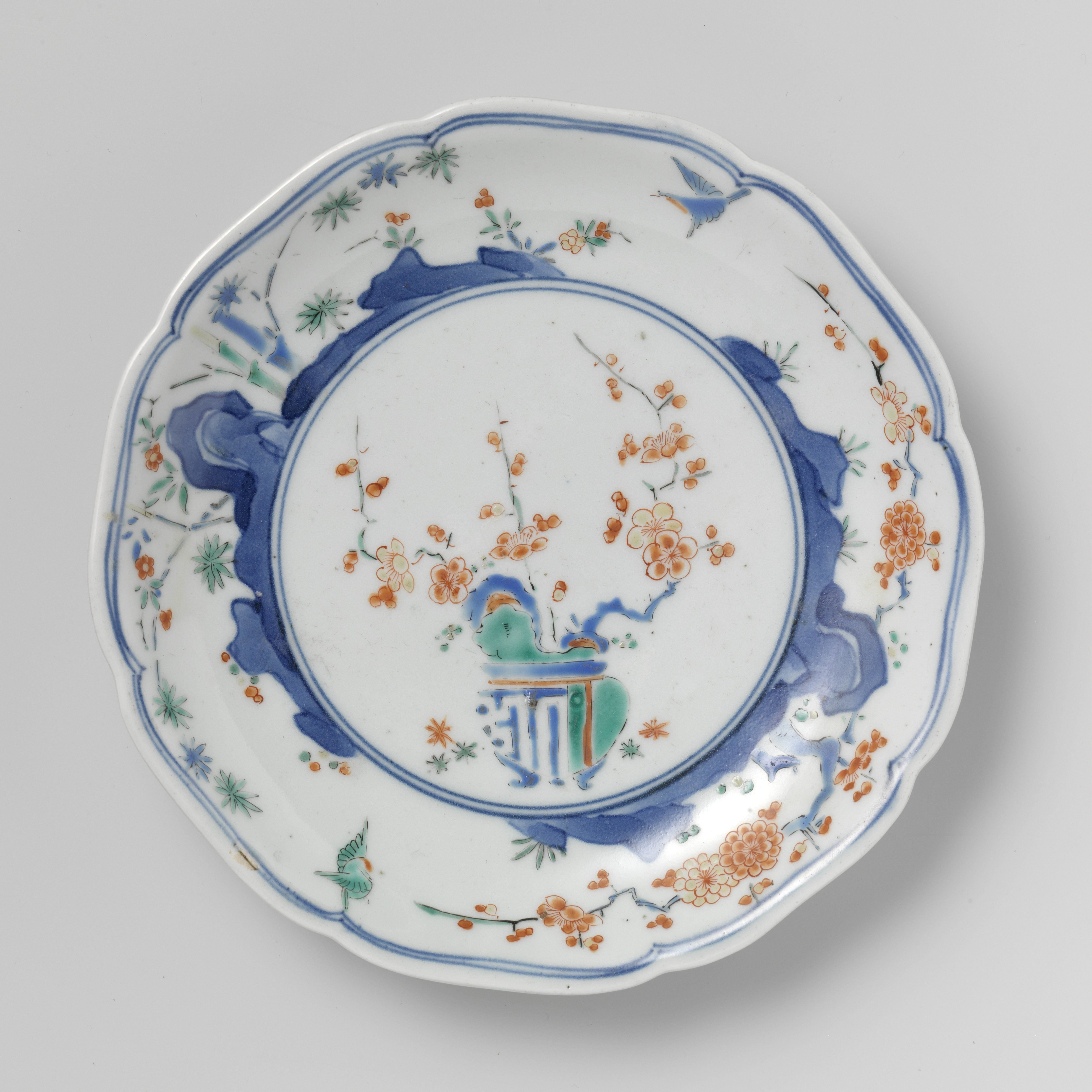 Scalloped dish with flowerpot, rocks, birds, bamboo and prunus