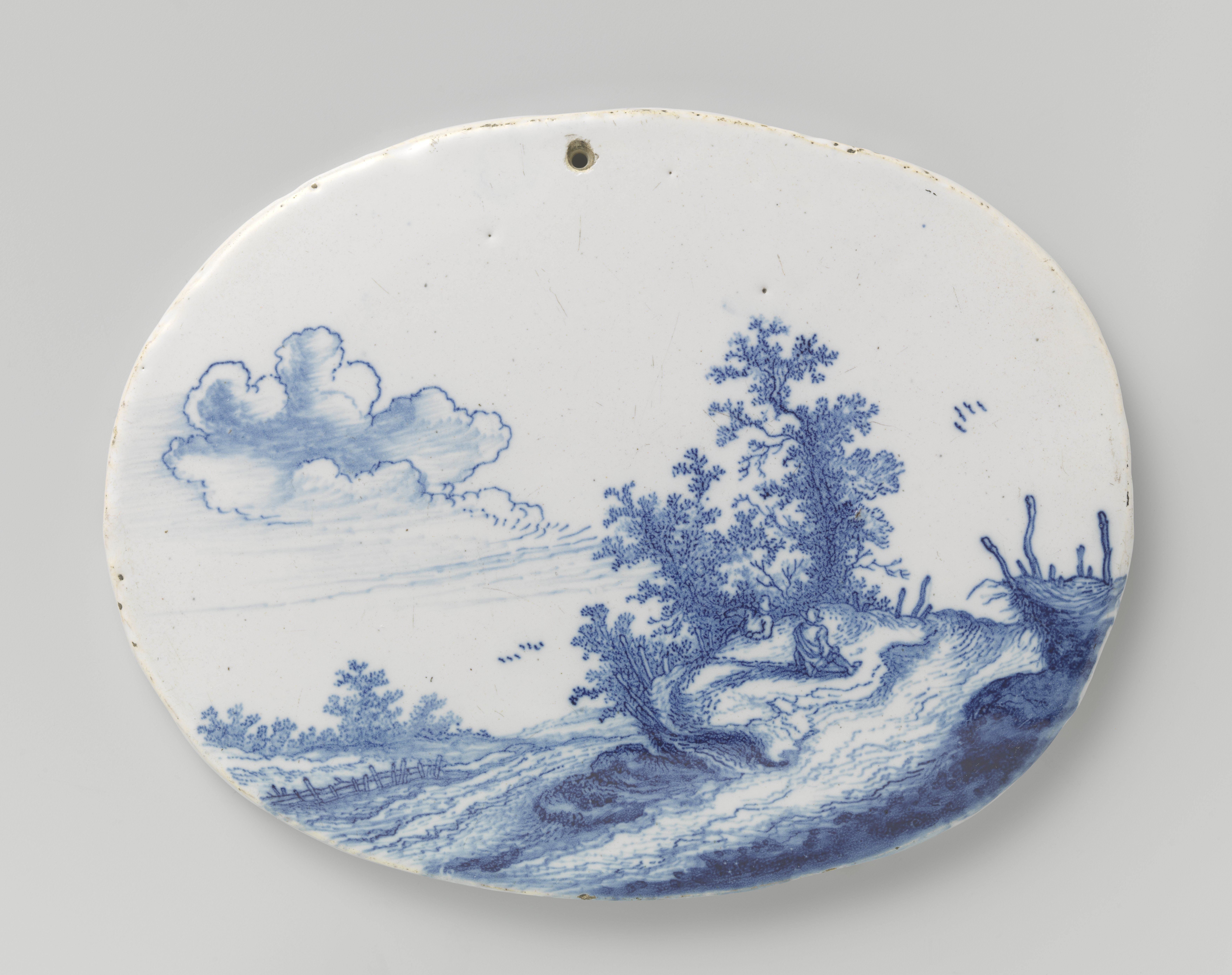 Twee ovale platen met landschappen
