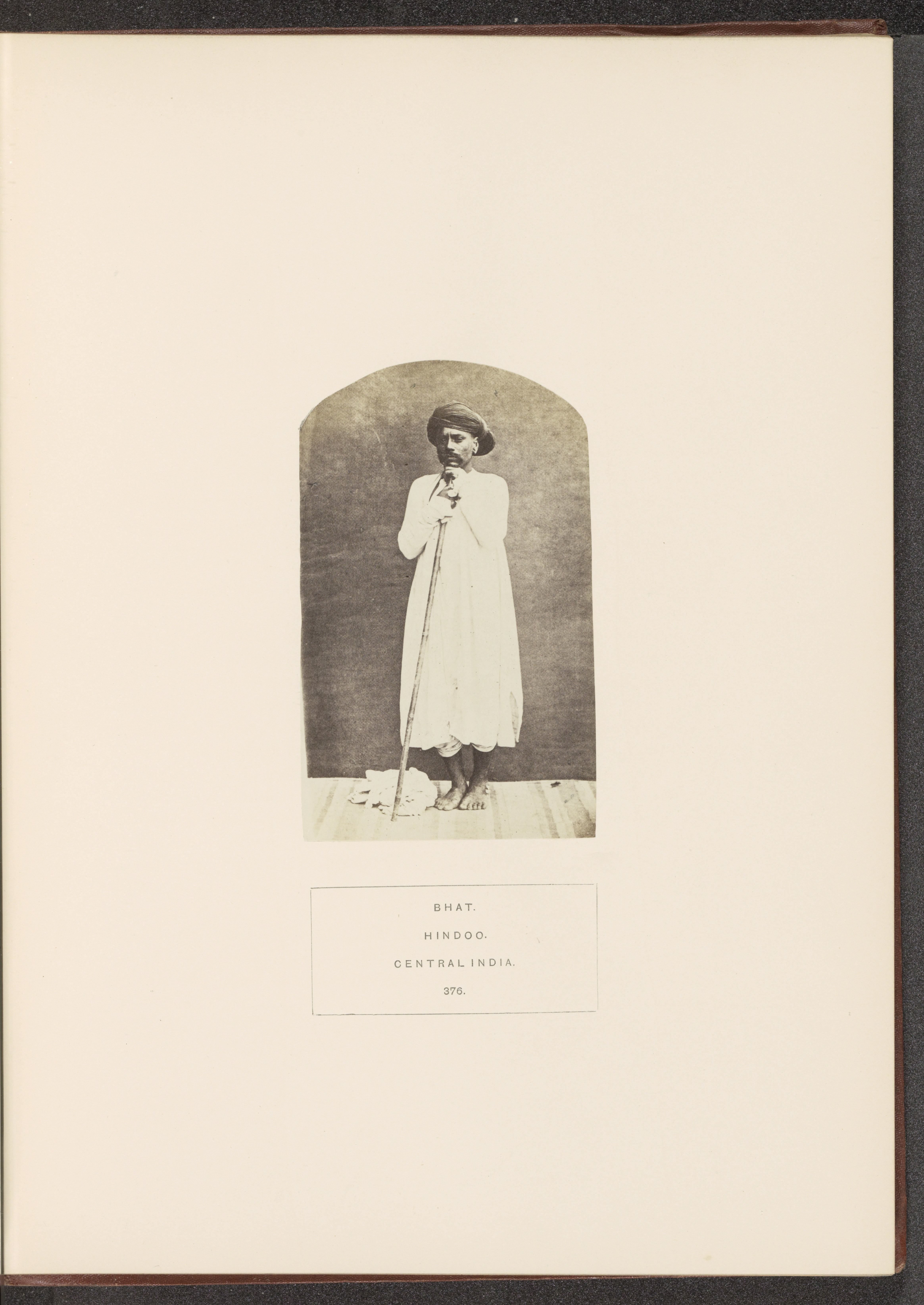 Portrait of an unknown man from the Bhat community with a rod, Madhya Pradesh, India