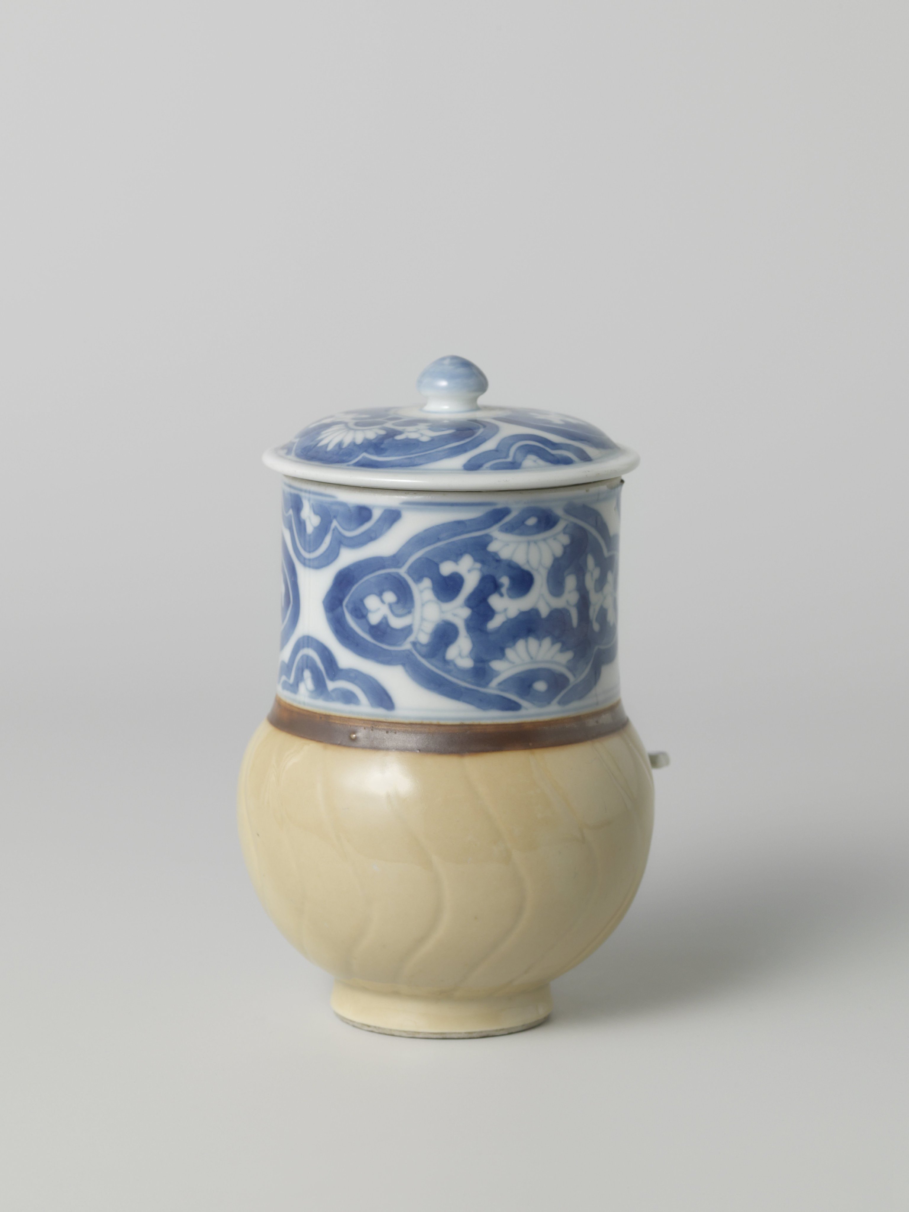 Tankard with light brown and panels with flower scrolls