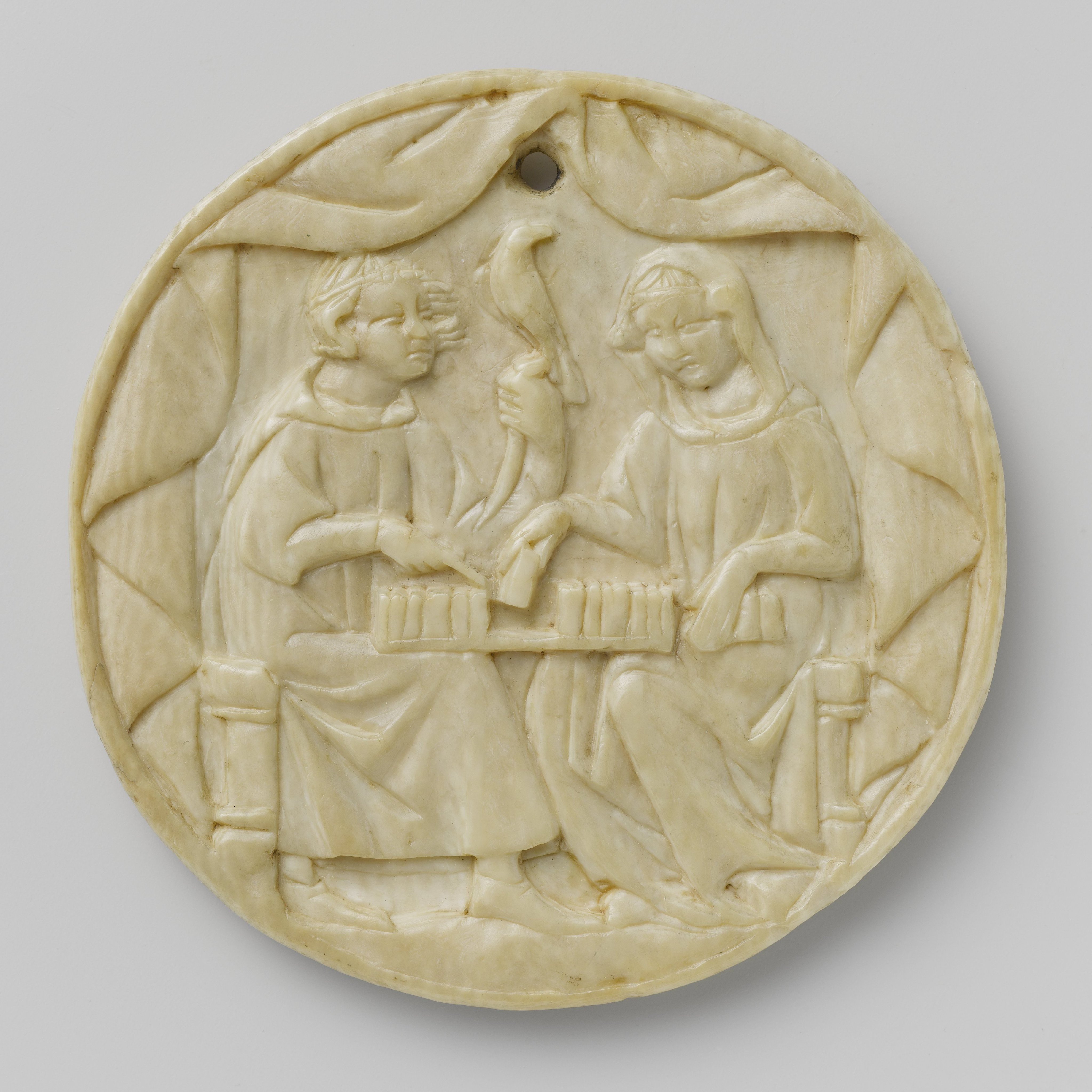 Cover of a mirror case with a man and a woman playing chess