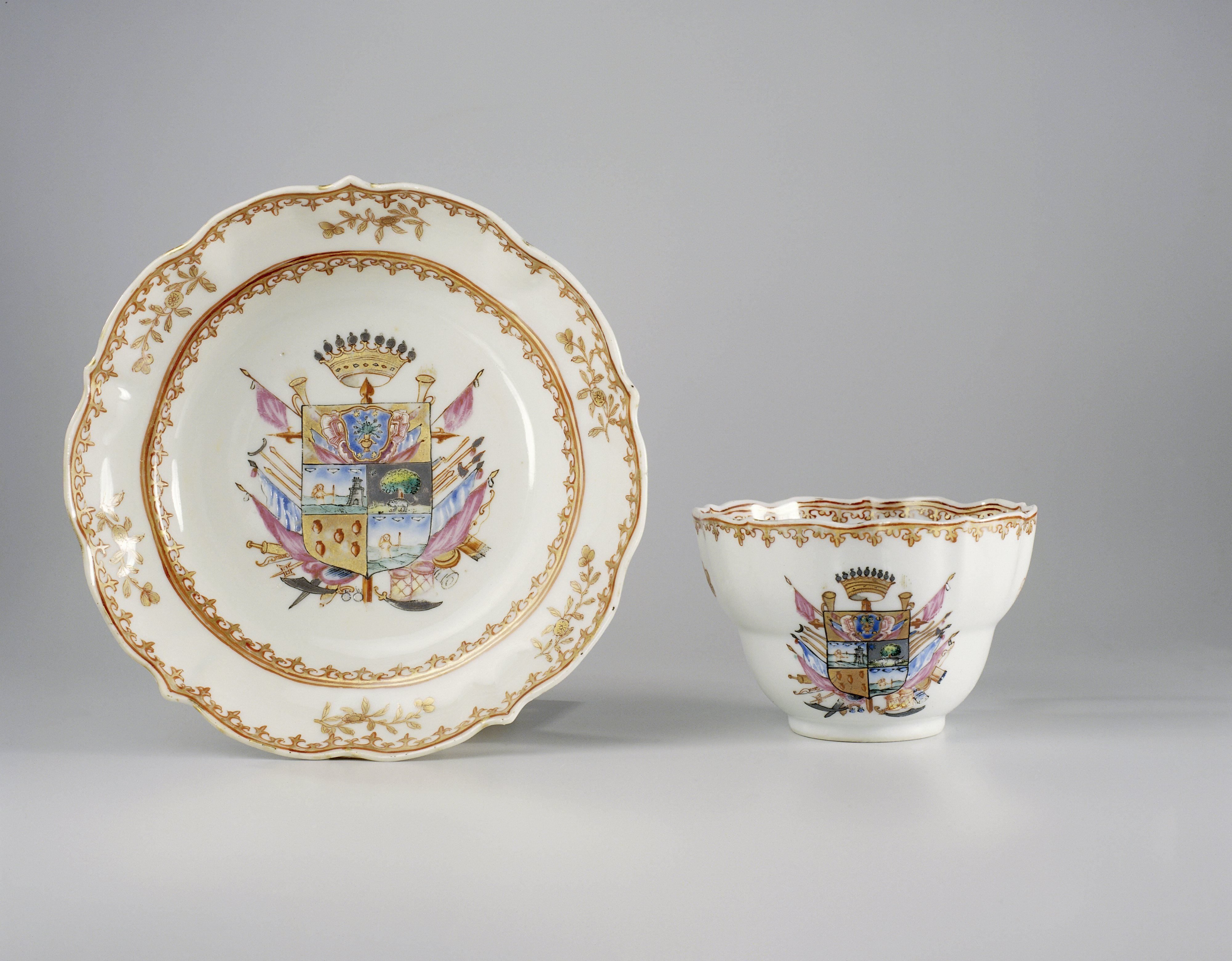 Cup with handle and saucer with a coat of arms, flower sprays and spearhead-borders