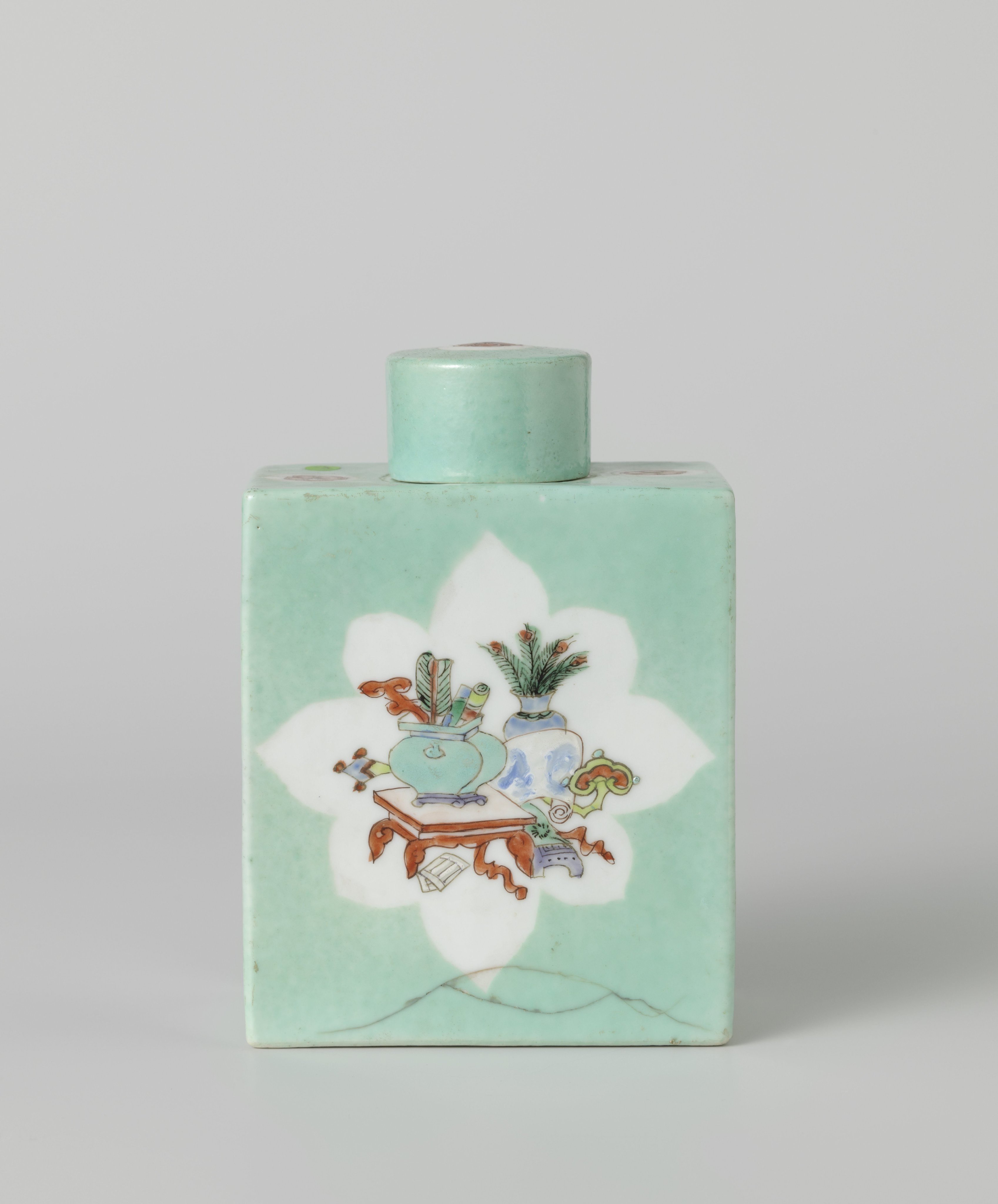 Rectangular tea caddy covered with a light blue glaze and antiquities in panels