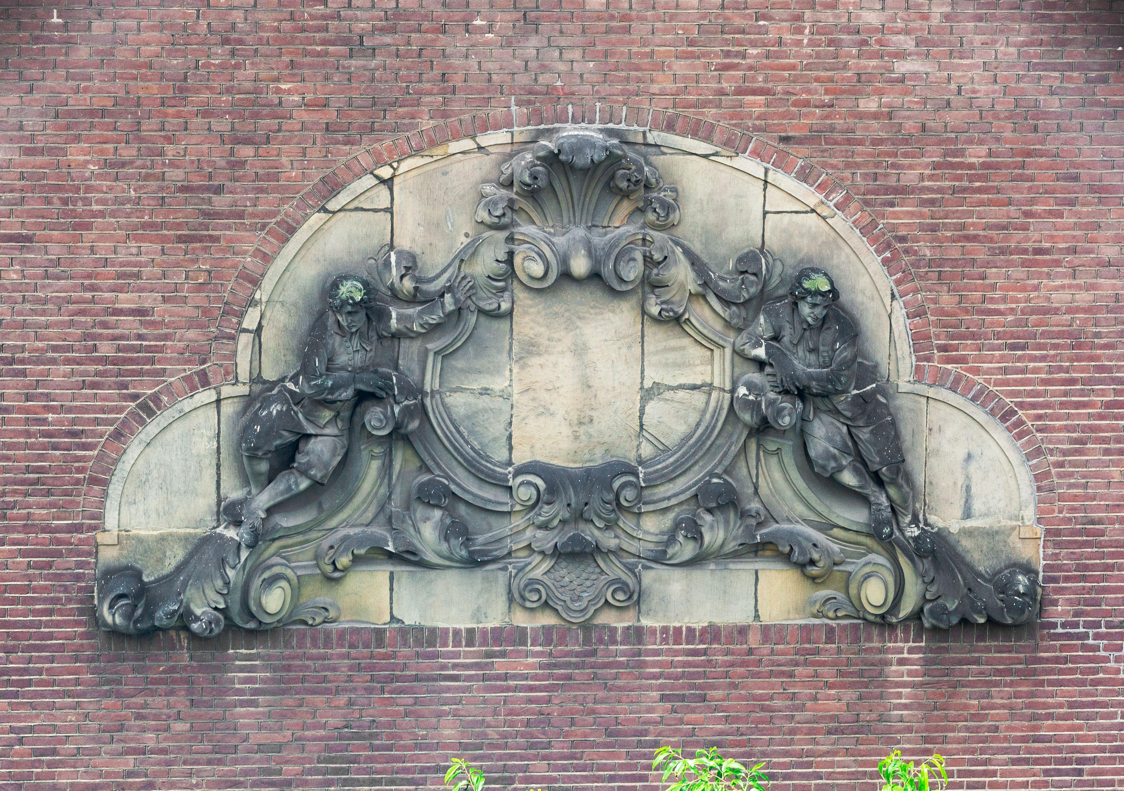 Gable Stone with a Cartouche Flanked by Two Orphan Boys