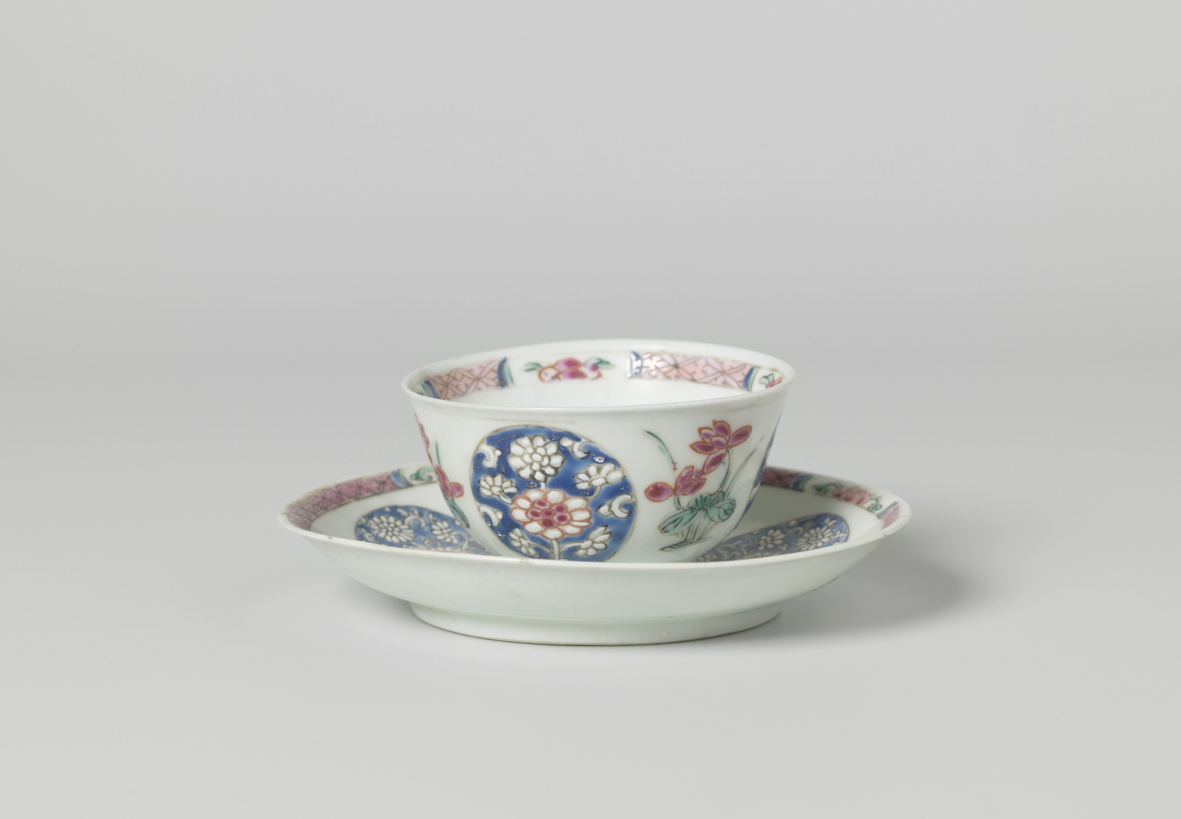 Bell-shaped cup and saucer with lotusplants and roundels with chrysanthemum scrolls