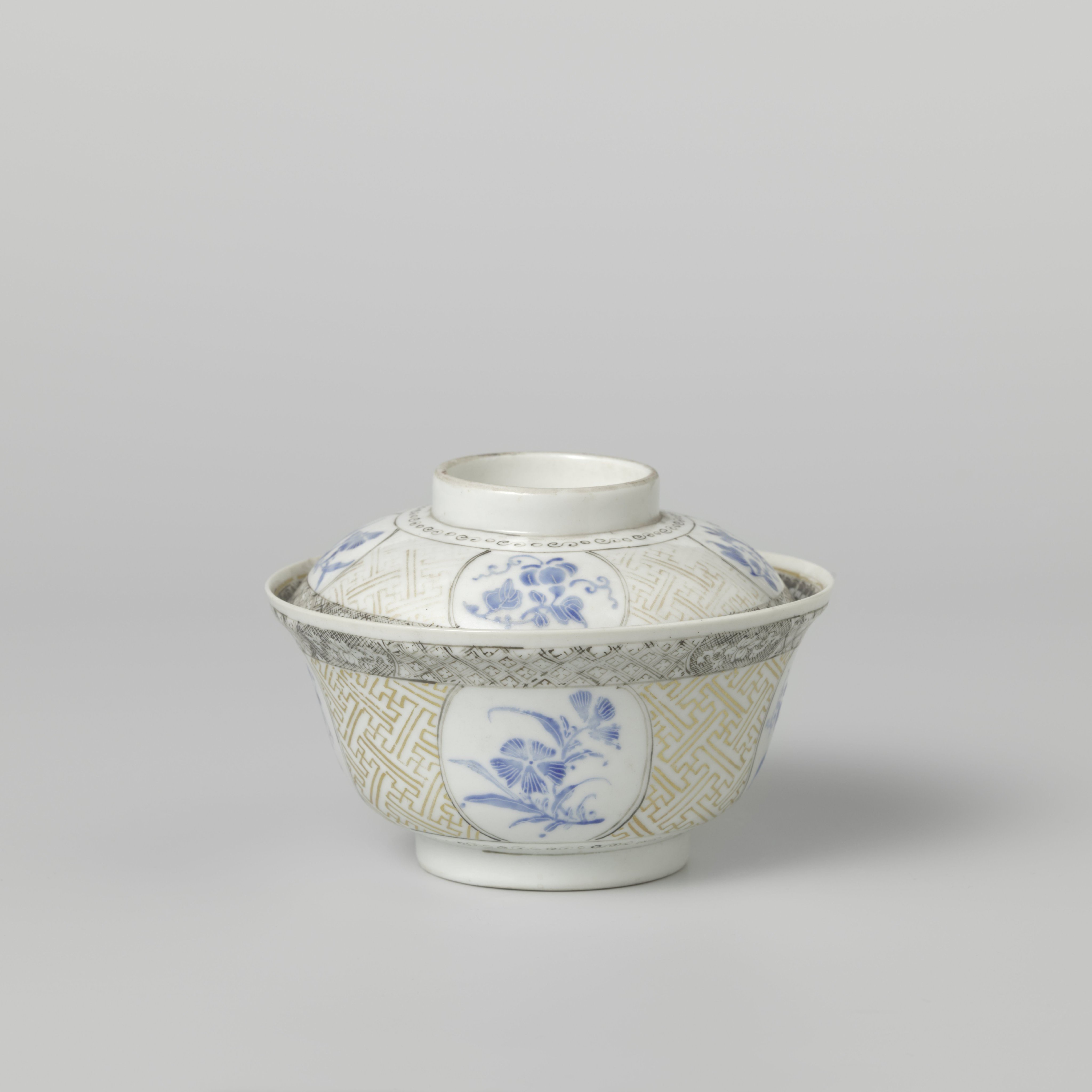 Covered bowl with flowering plants, swastika and diaper pattern