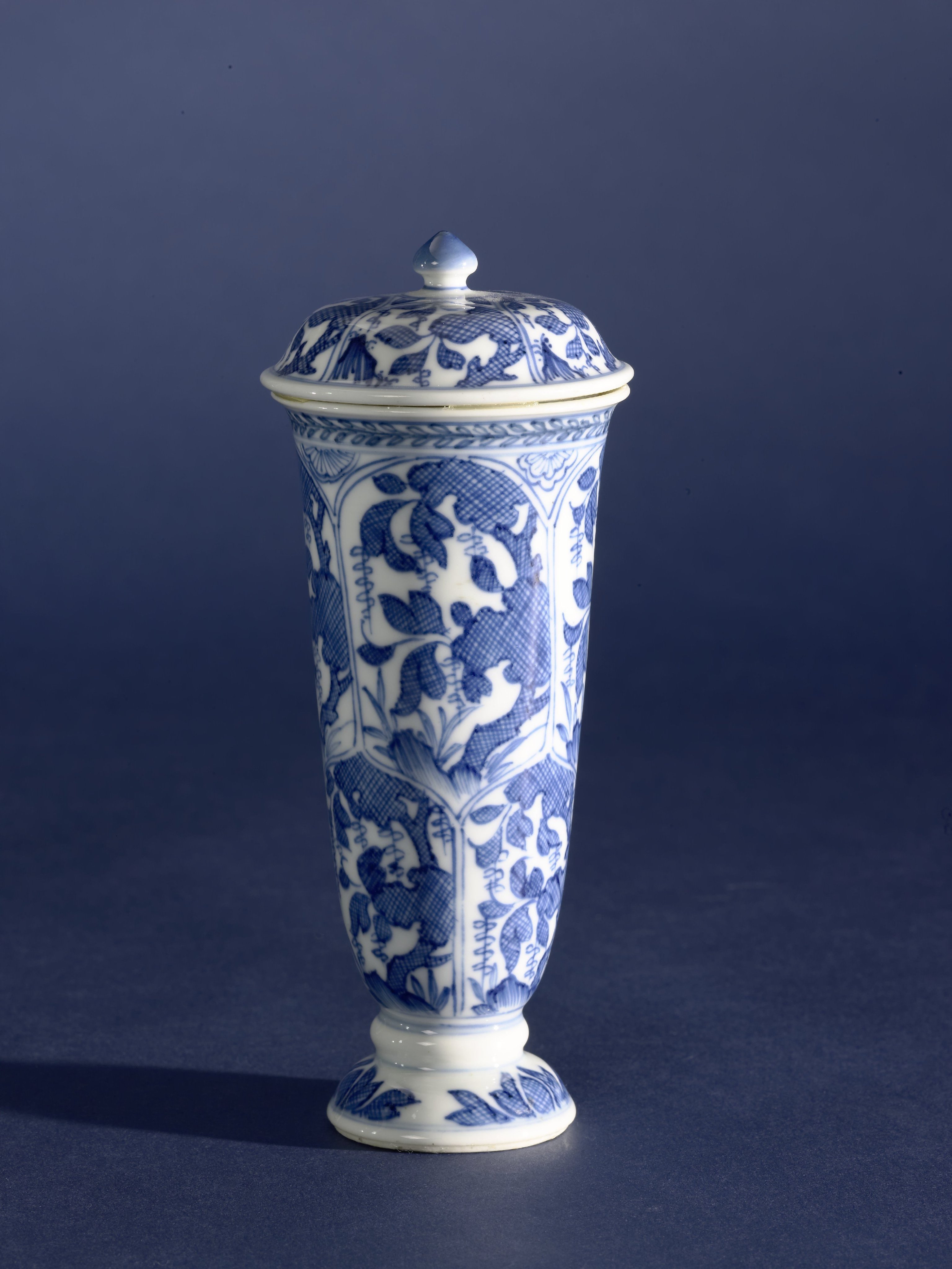 Bell-shaped covered beaker vase with hatched plants in petal-shaped panels