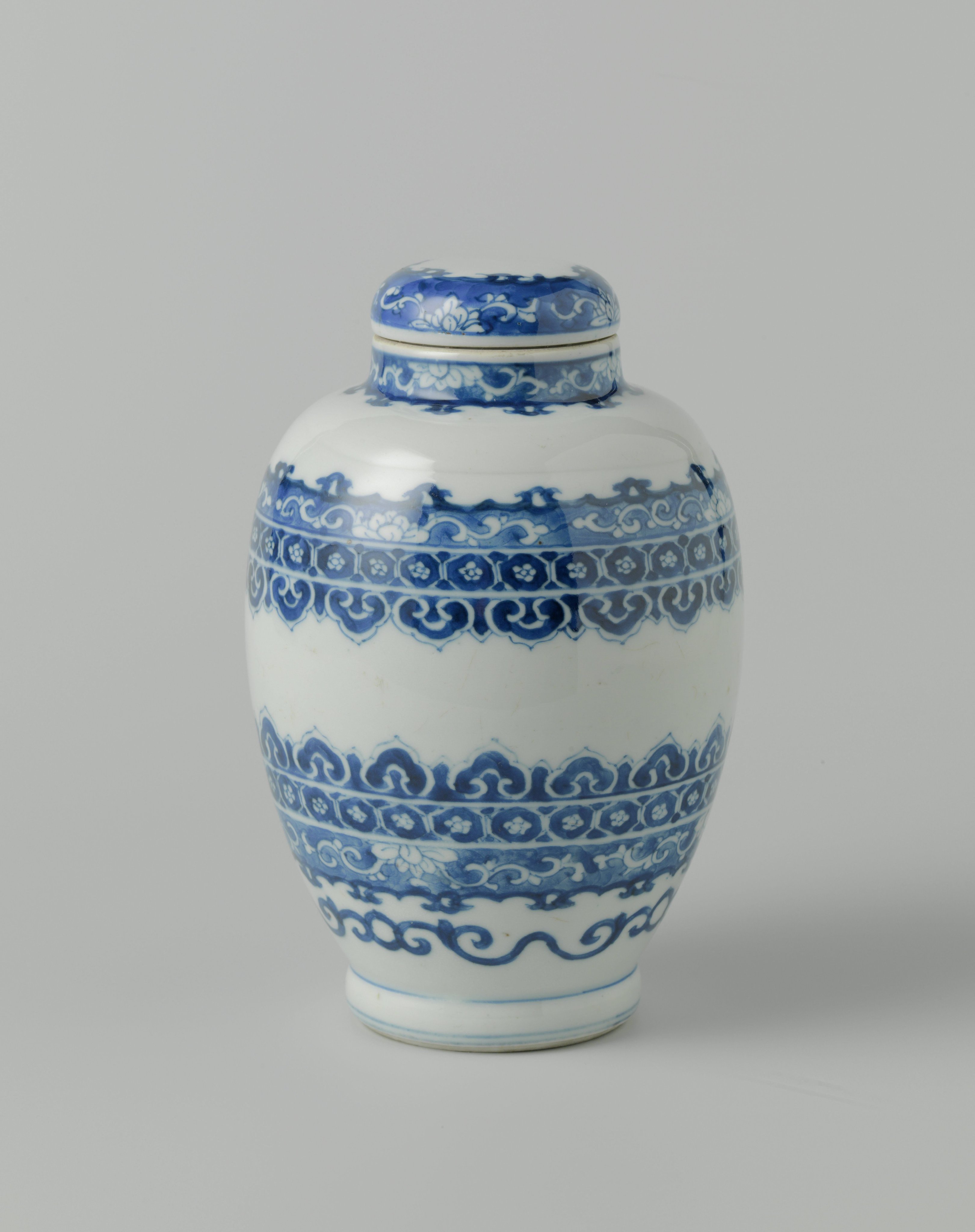Ovoid covered jar with ornamental borders