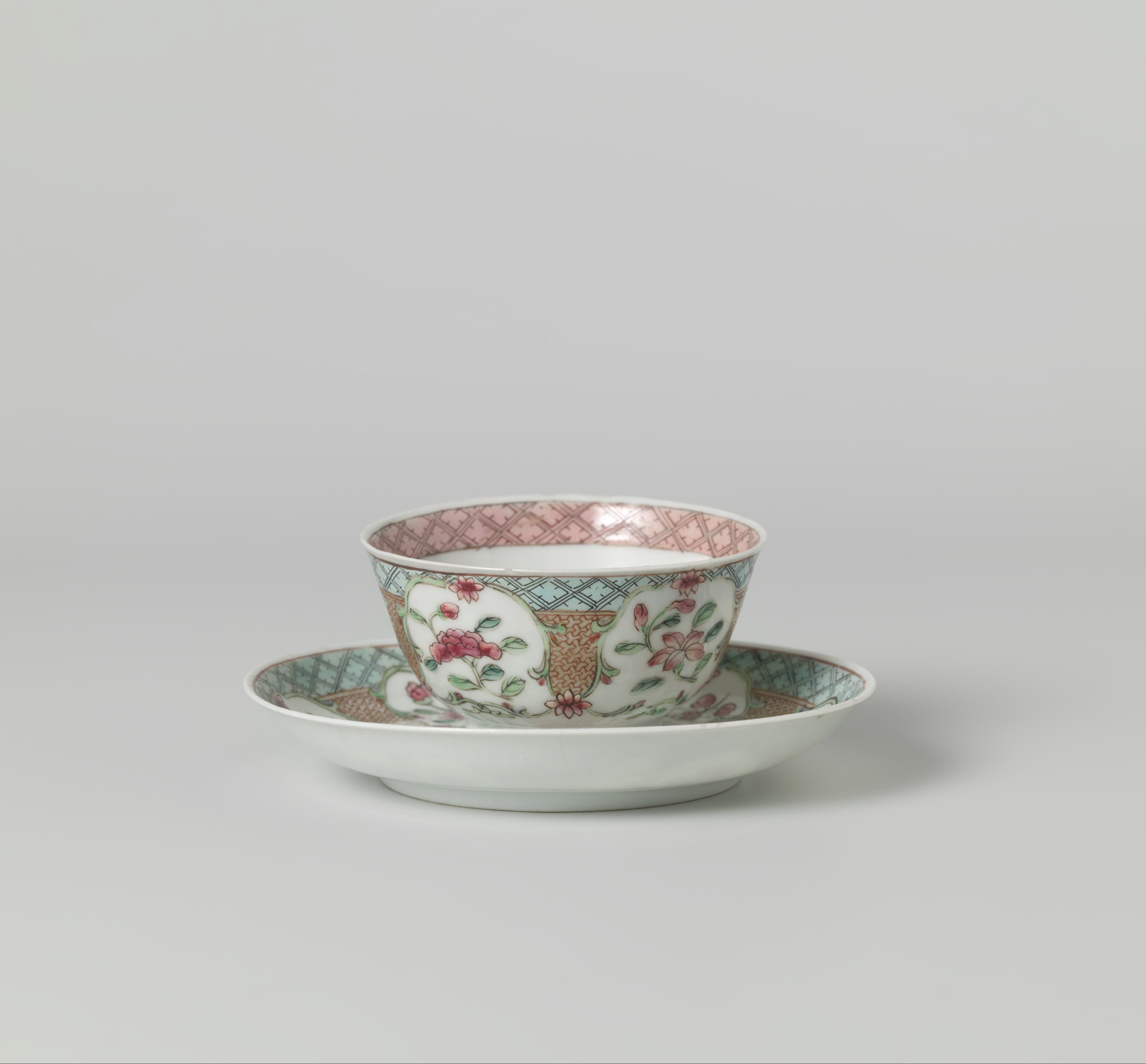 Bell-shaped cup and saucer with a flower basket, floral scrolls and flower sprays
