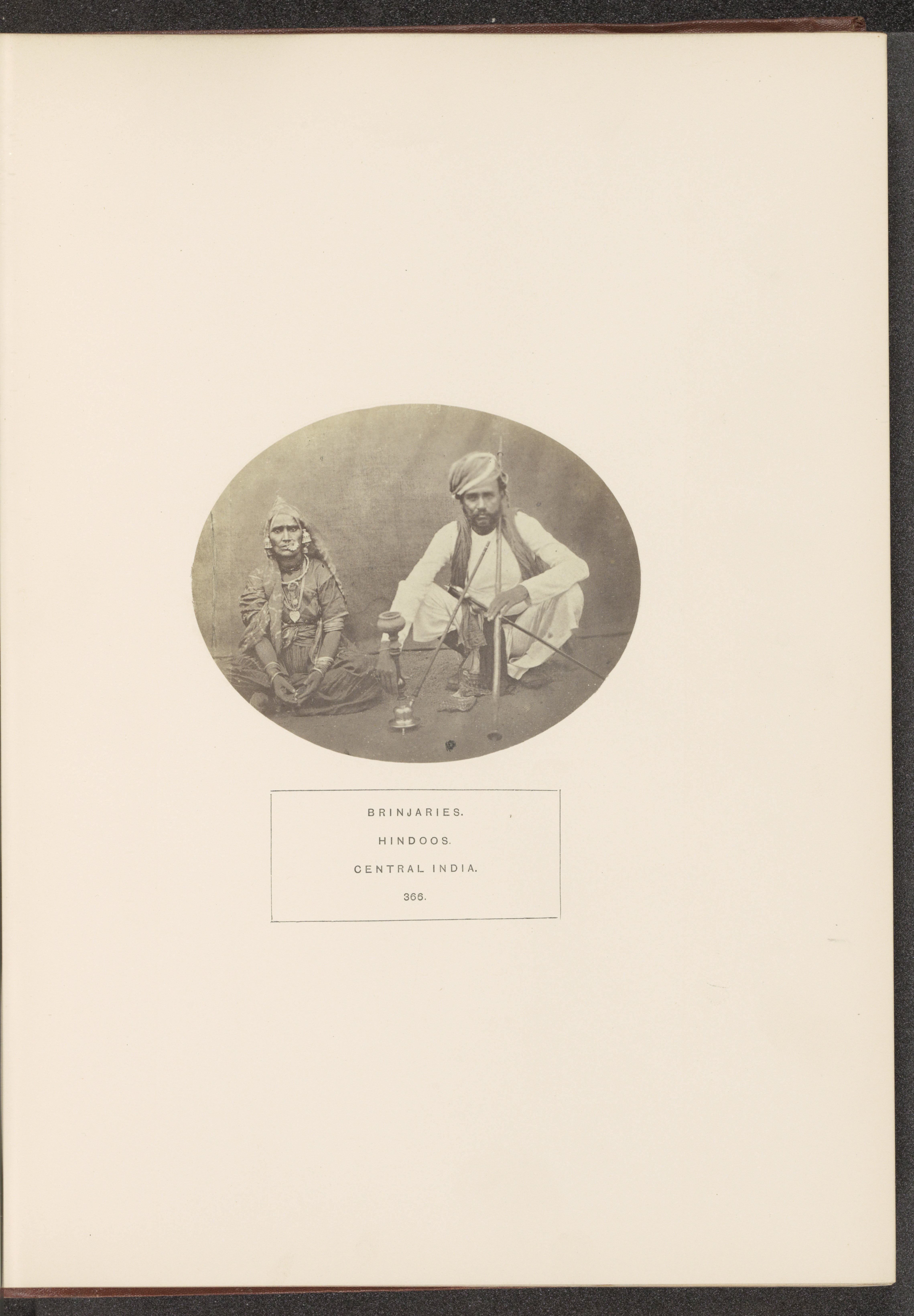 Portrait of two unknown people from the Banjara tribe with a hookah, Madhya Pradesh, India