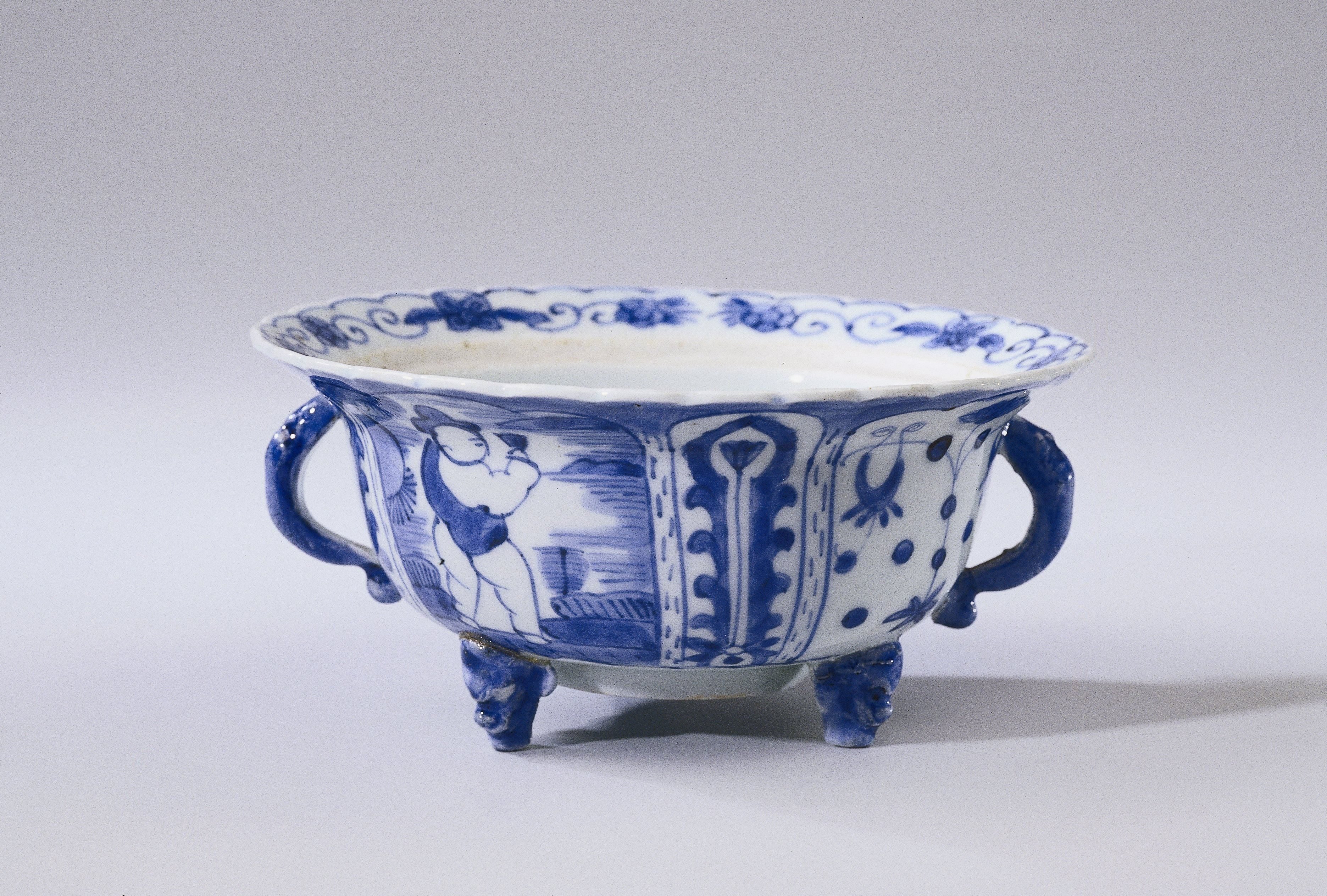 Covered bowl or butter tub with a figure in a landscape, lotus scrolls and flower sprays