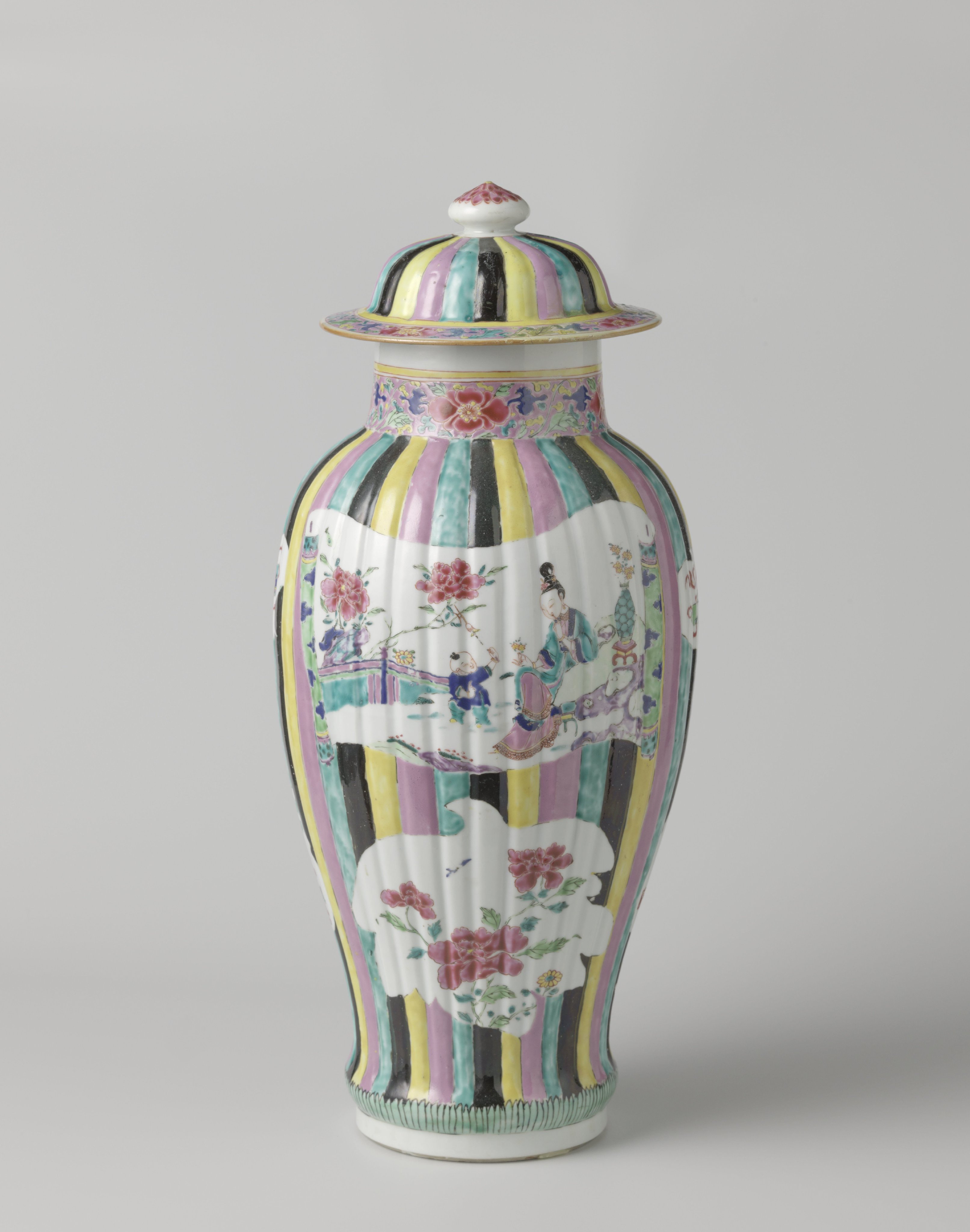 Covered jar with figures, flower sprays and auspicious symbols in shaped panels on a multi-colored ground