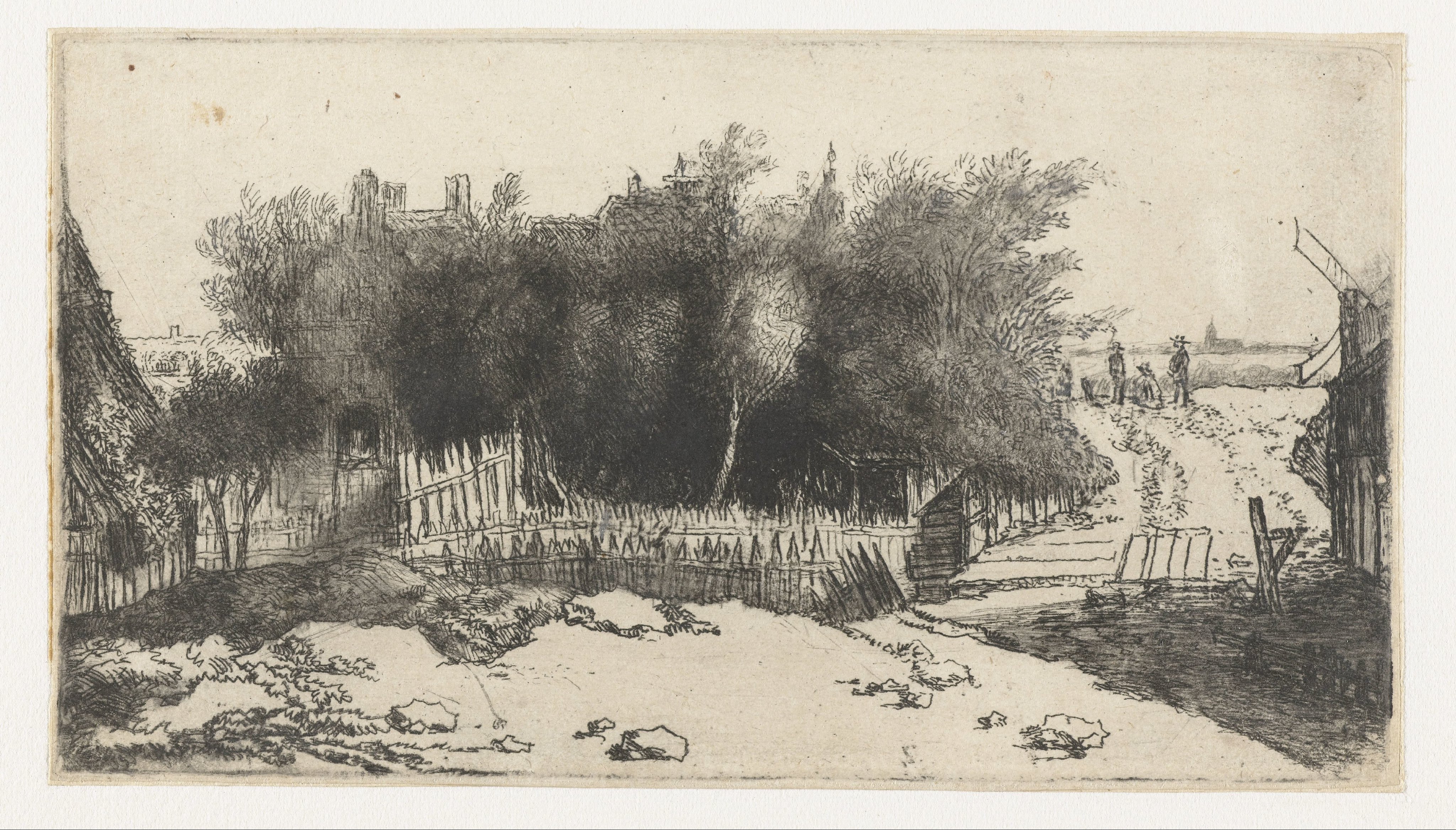 Landschap met een wit hek