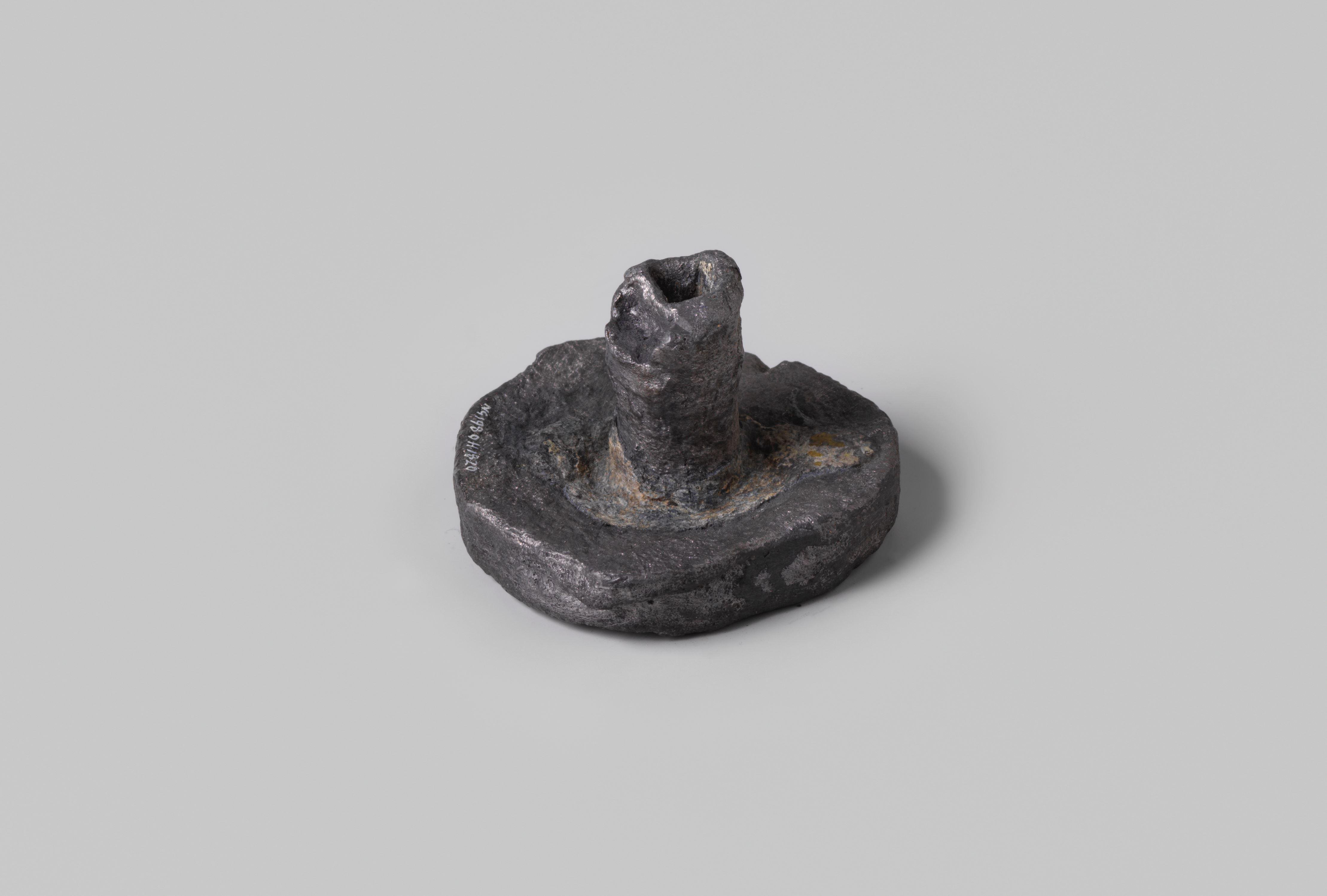 Lead weight from the wreck of the Dutch East India ship Hollandia, dated 1743