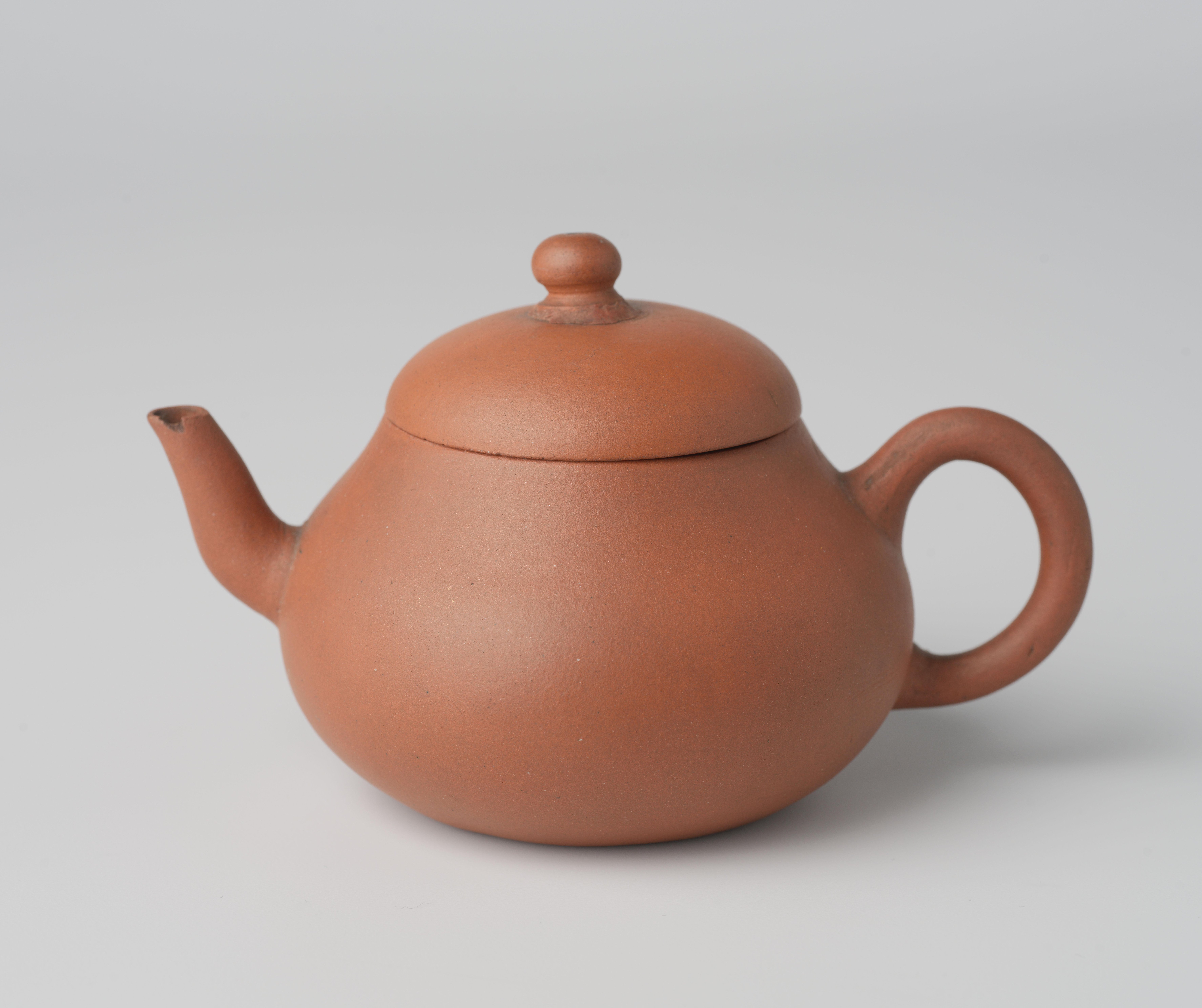 Squat pear-shaped teapot of red stoneware
