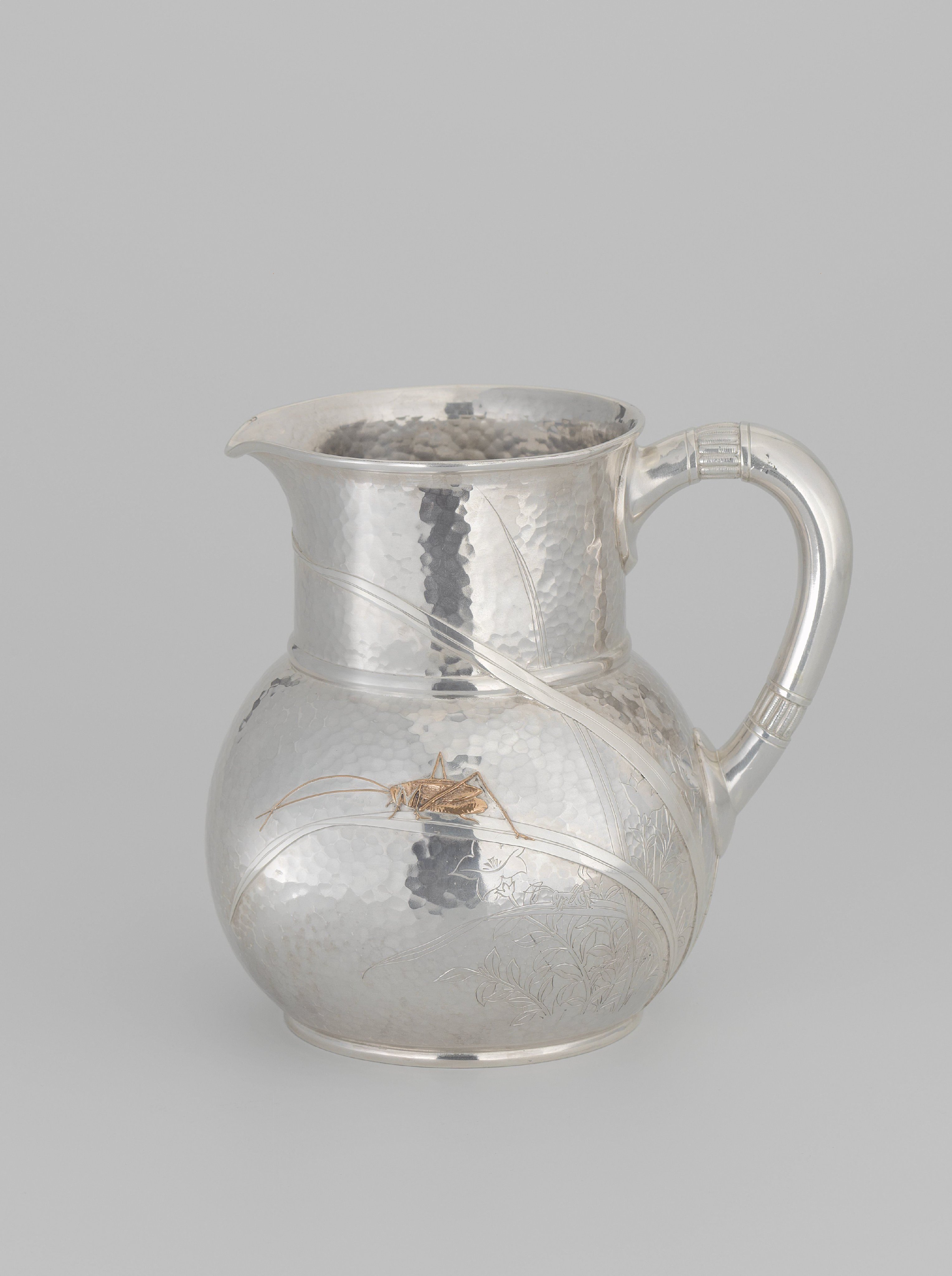 Water jug with plant and floral motifs