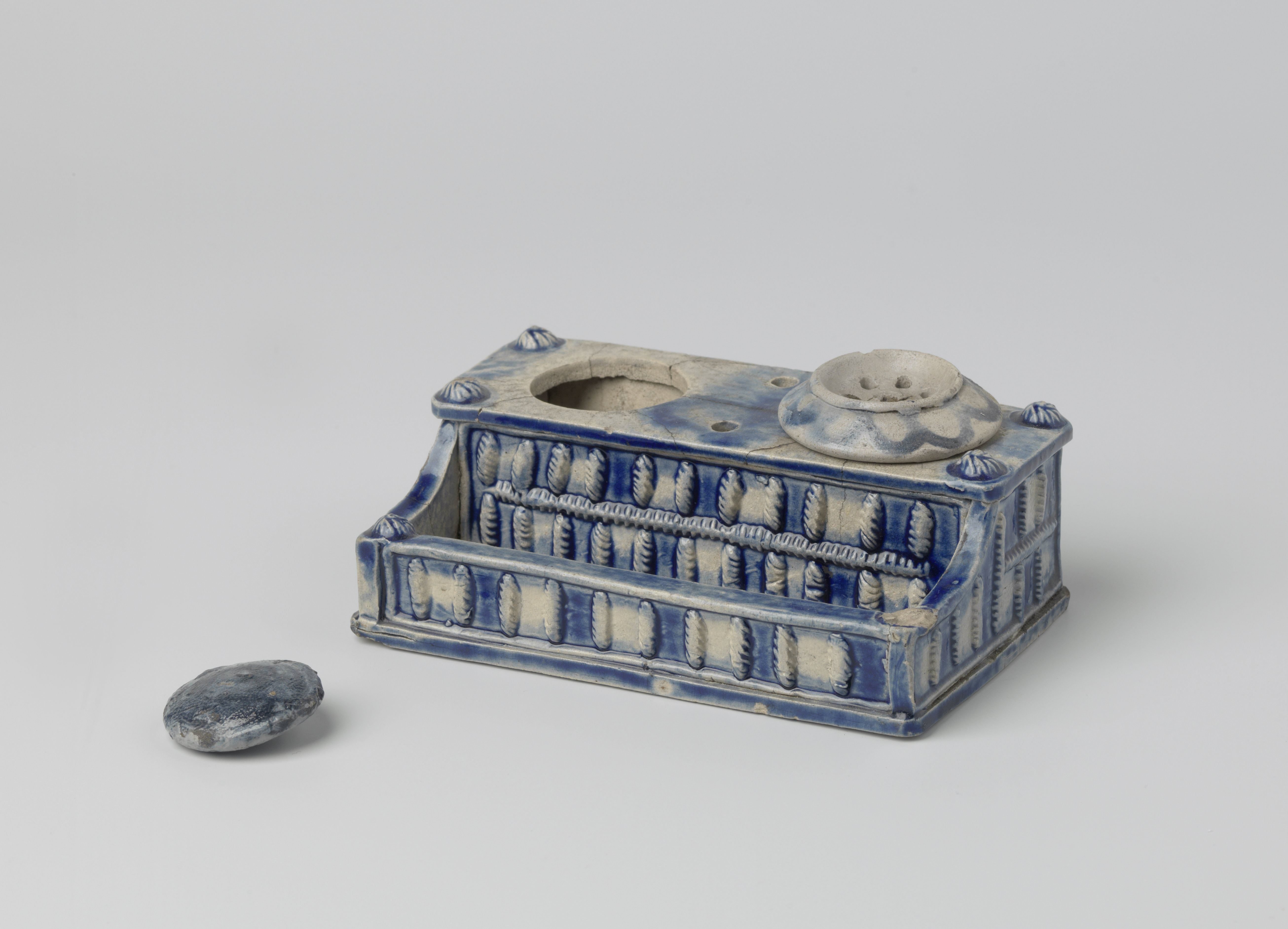 Ink stand with a relief decoration