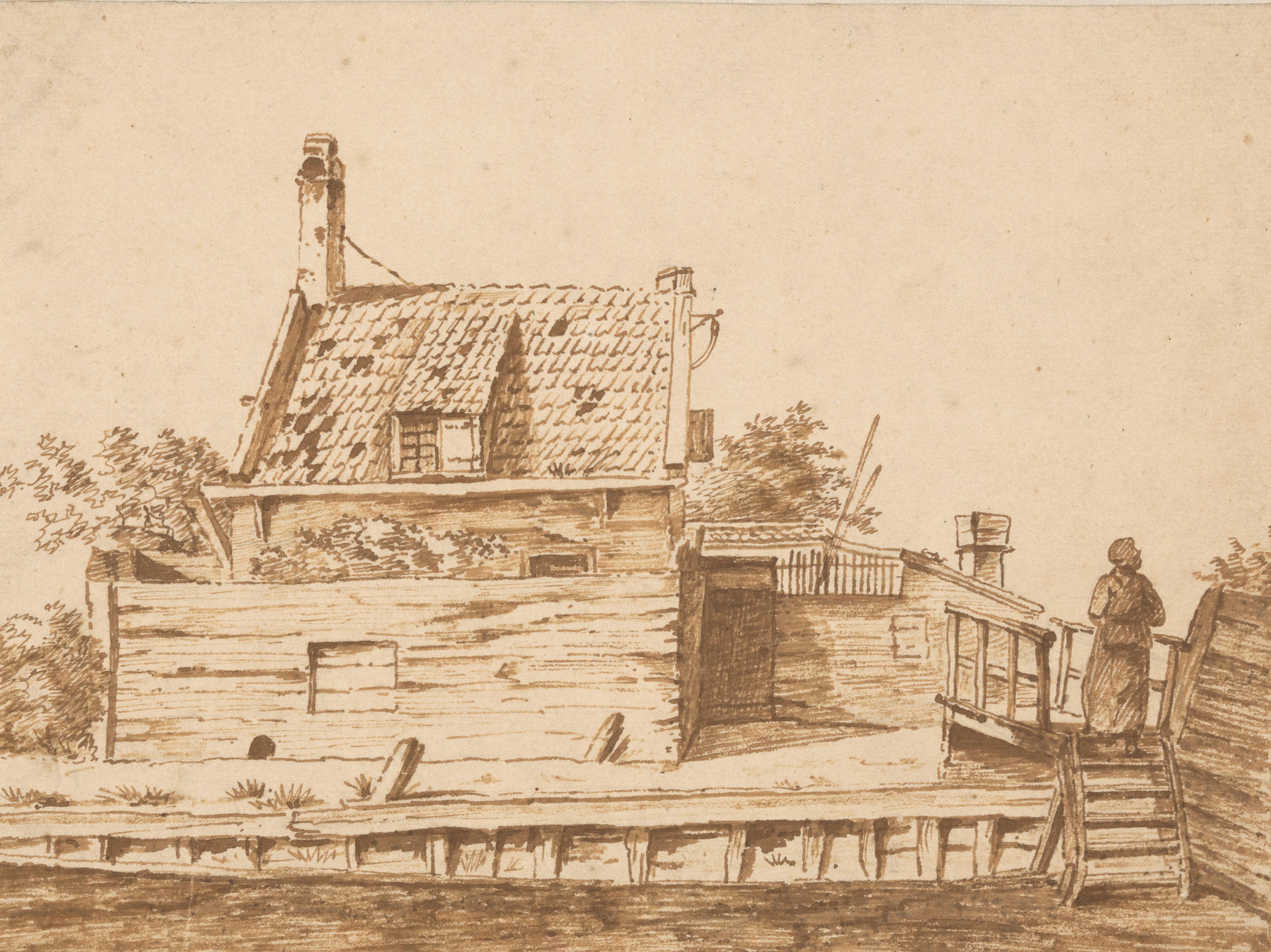 Huis met houten omheining aan het water