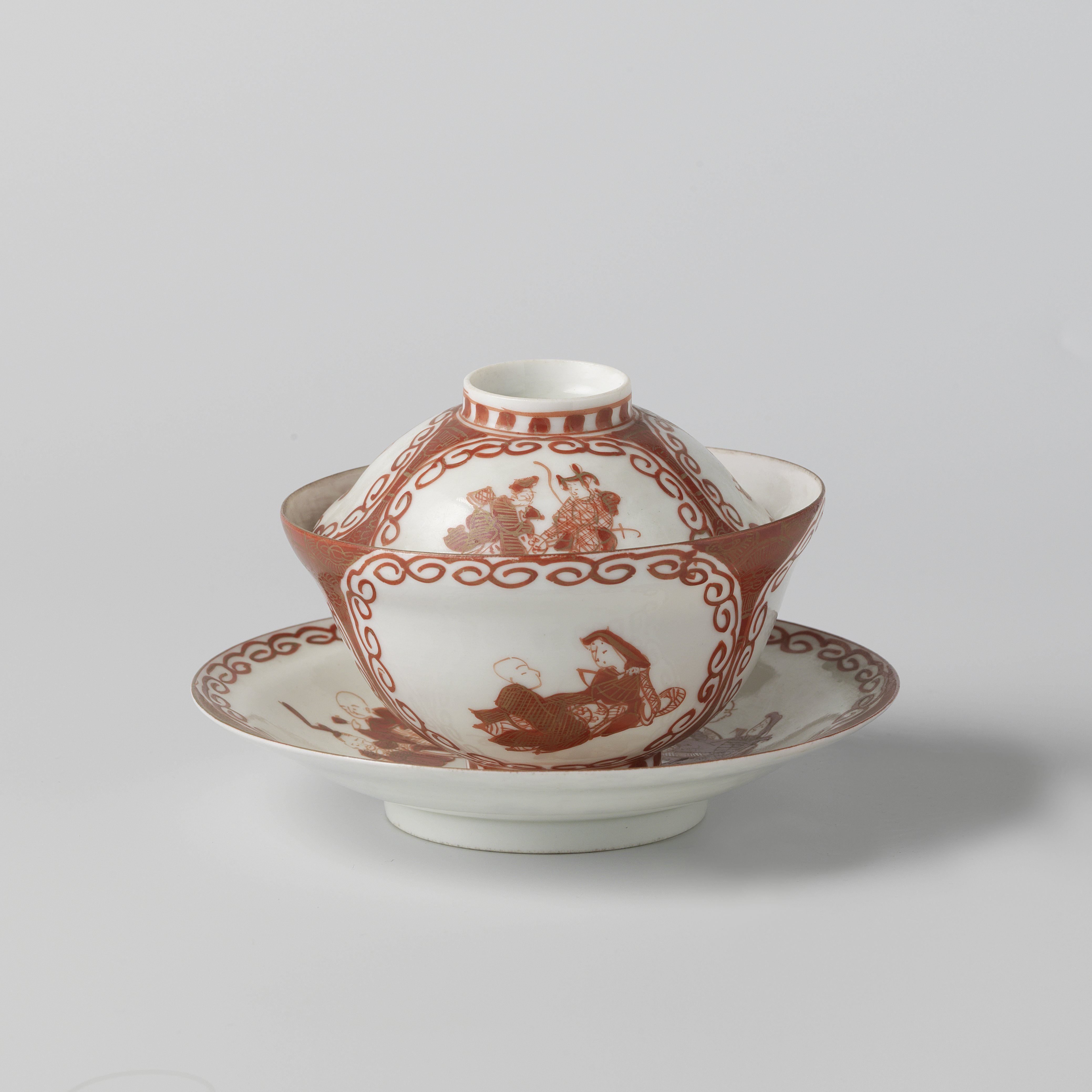 Covered cup and saucer with three panels with two seated figures