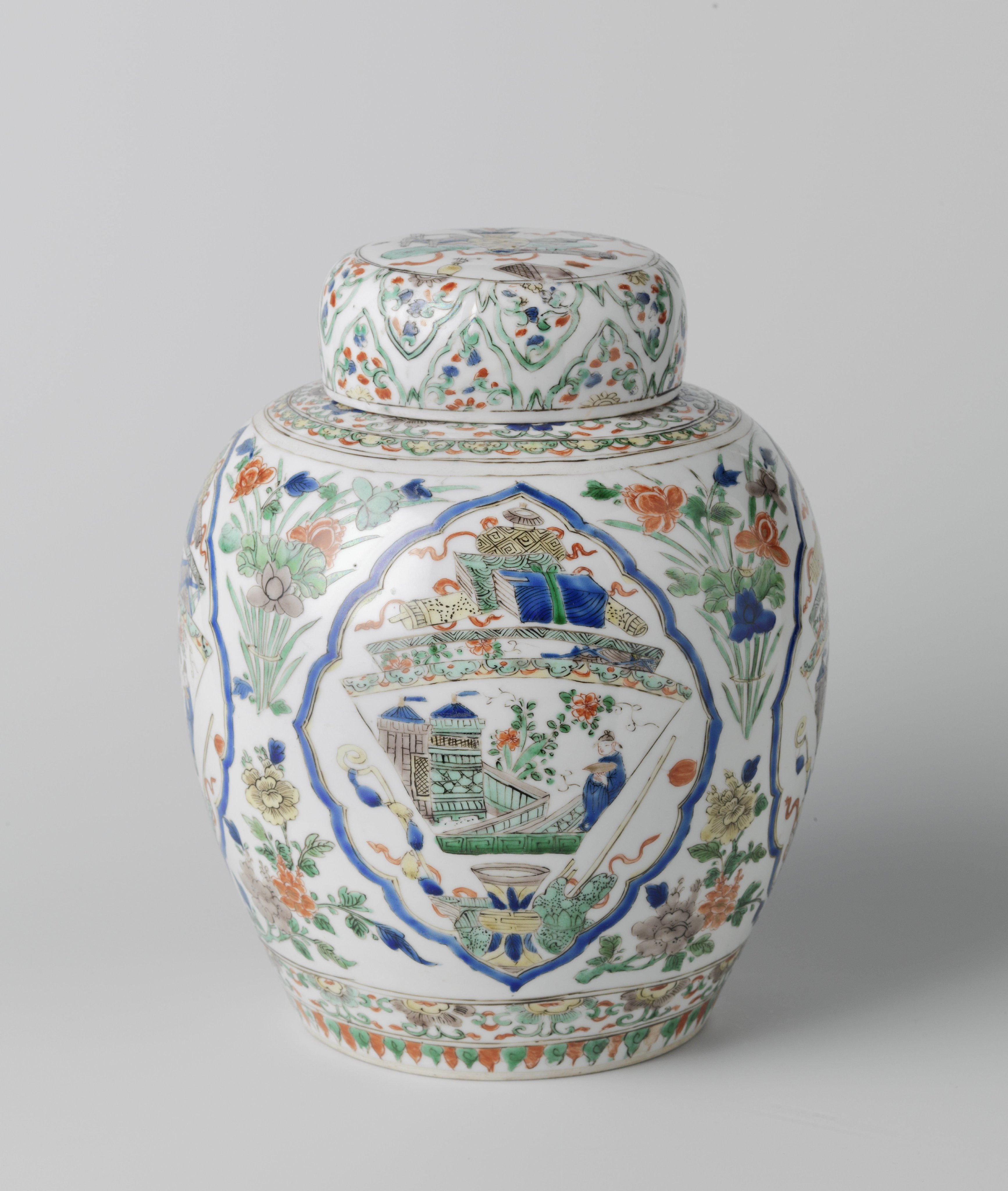 Ovoid covered jar with flowering plants and antiquities