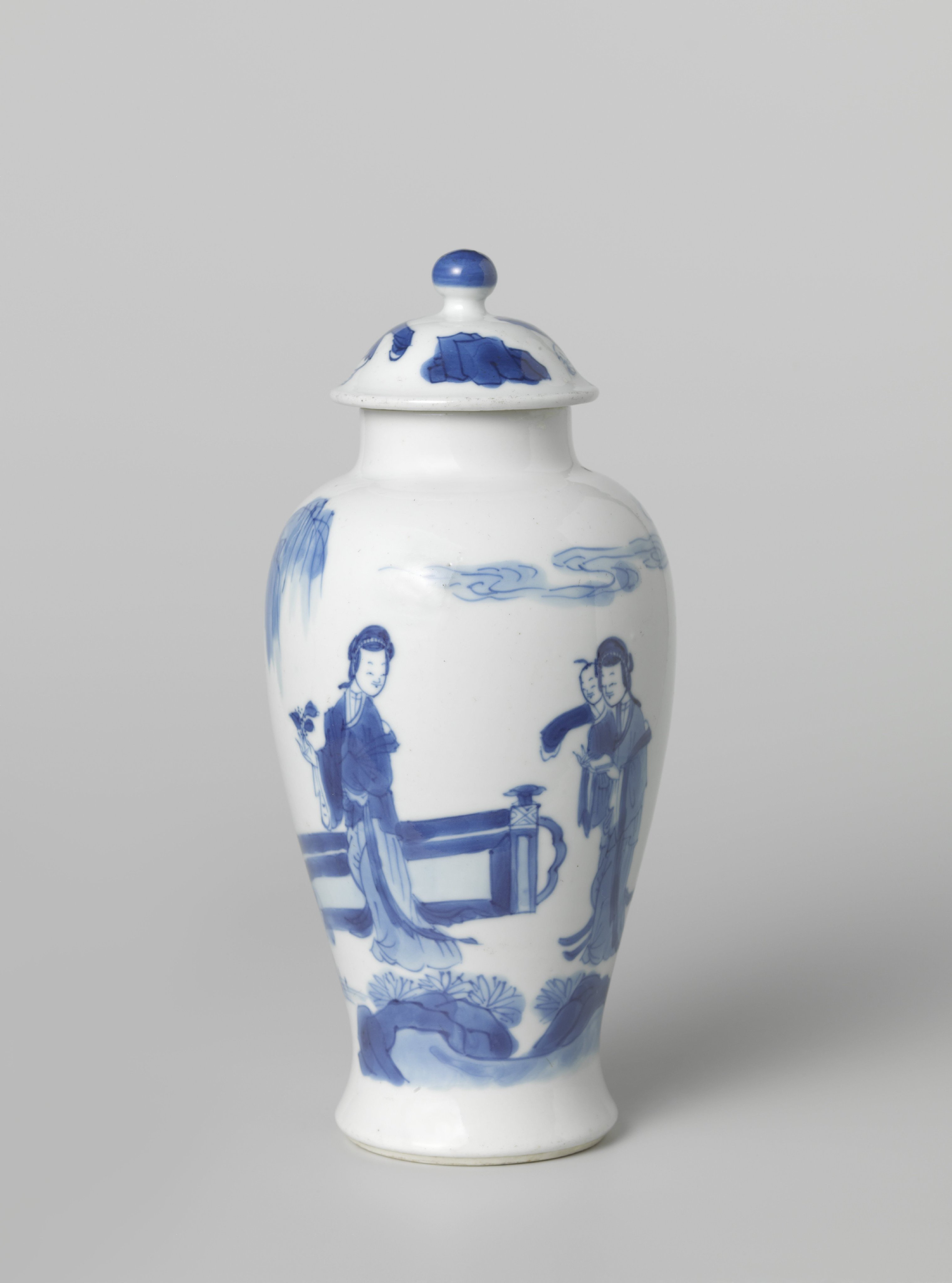 Covered jar with women and boys in a fenced garden