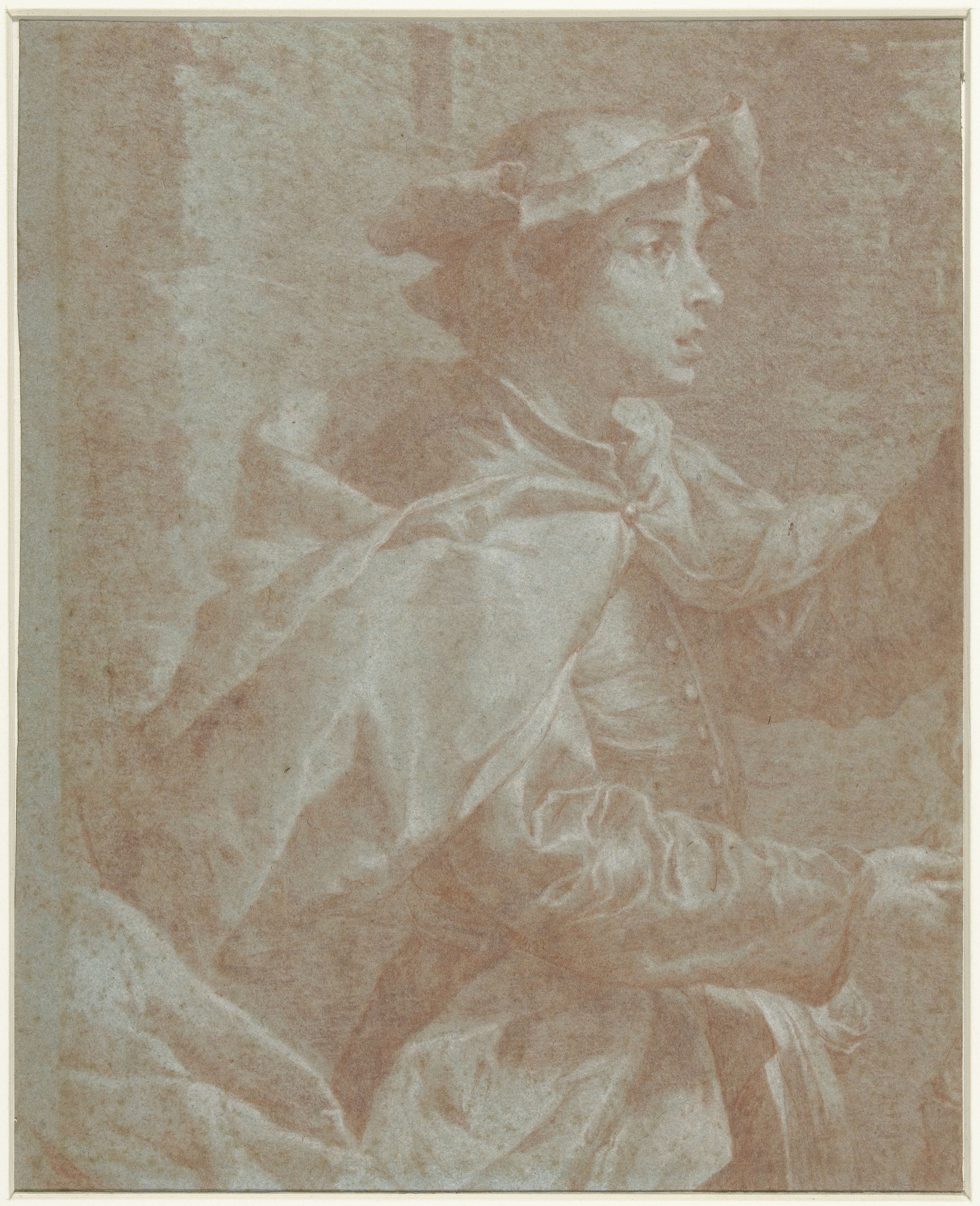 Jongeman in mantel en met een baret