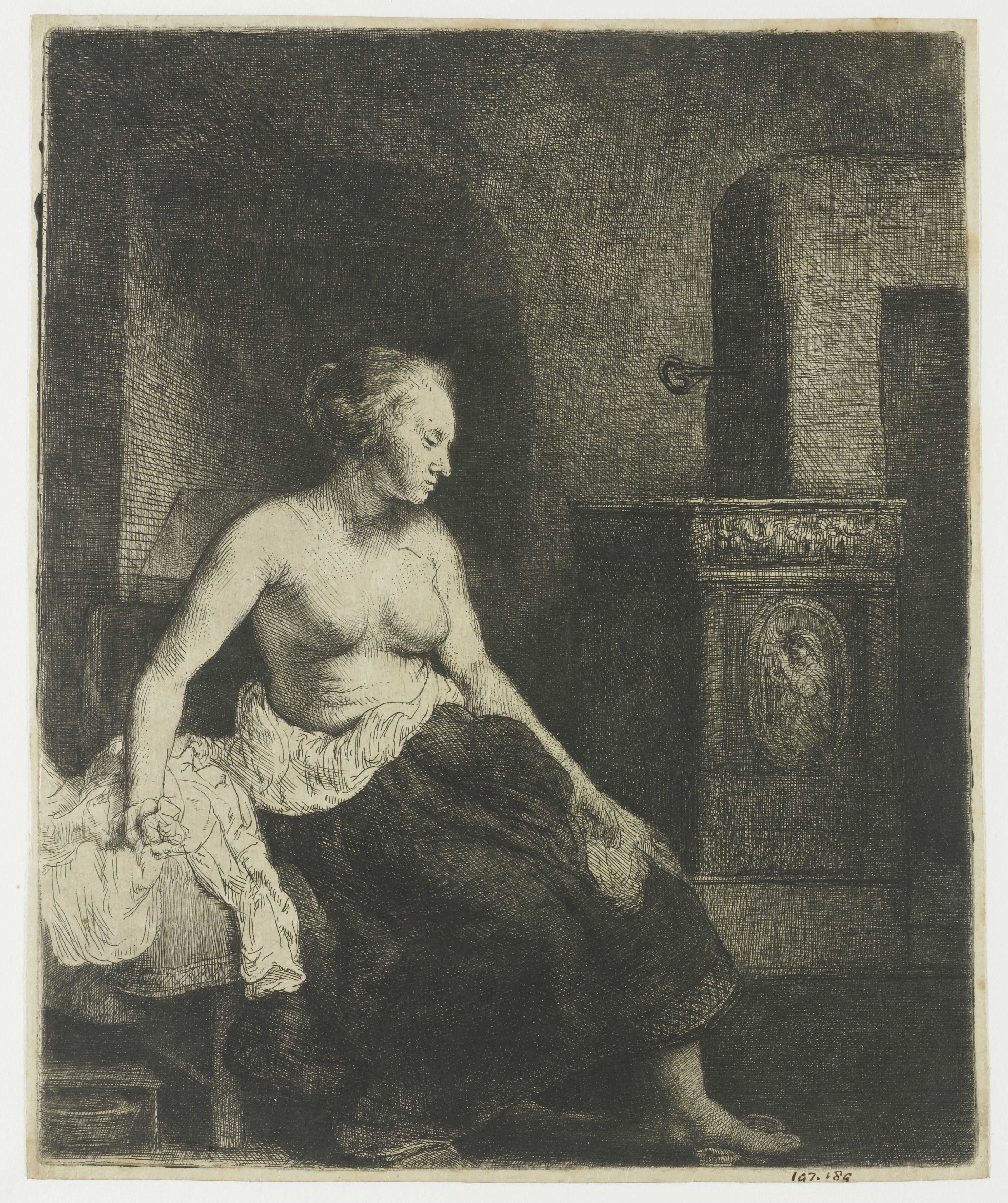 Woman sitting half dressed beside a stove