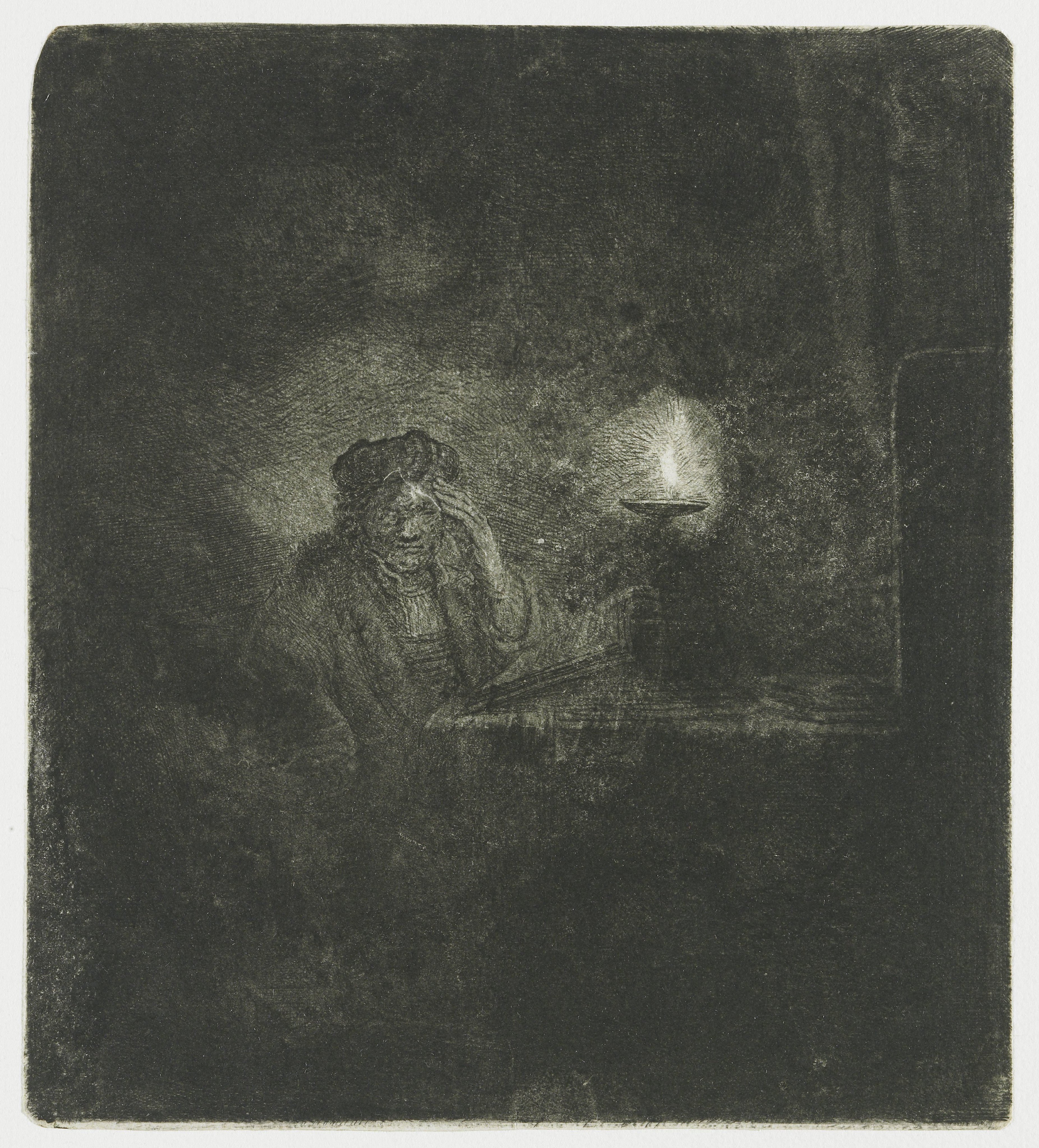 Student at a table by candlelight