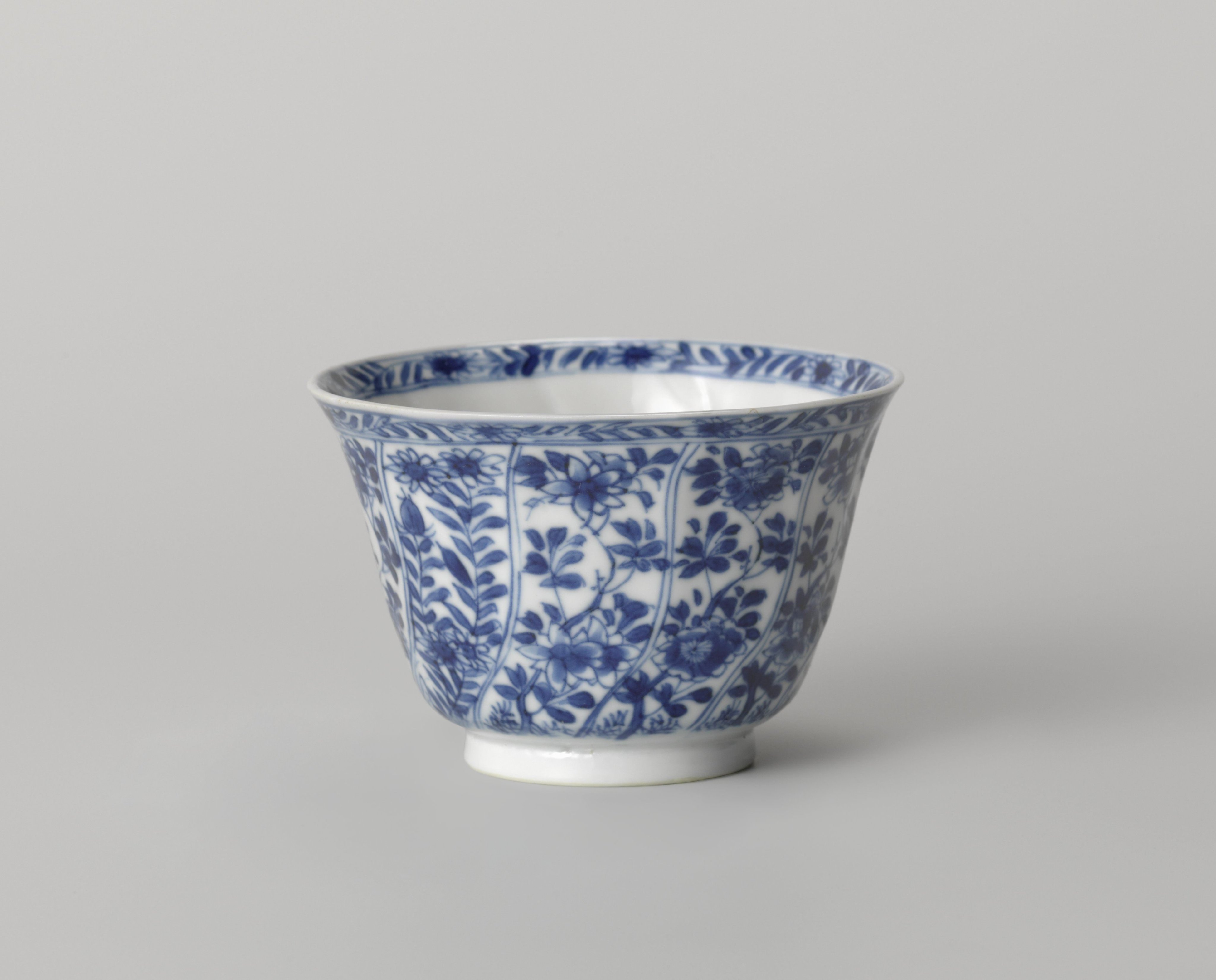Cup with twisted panels with flower sprays
