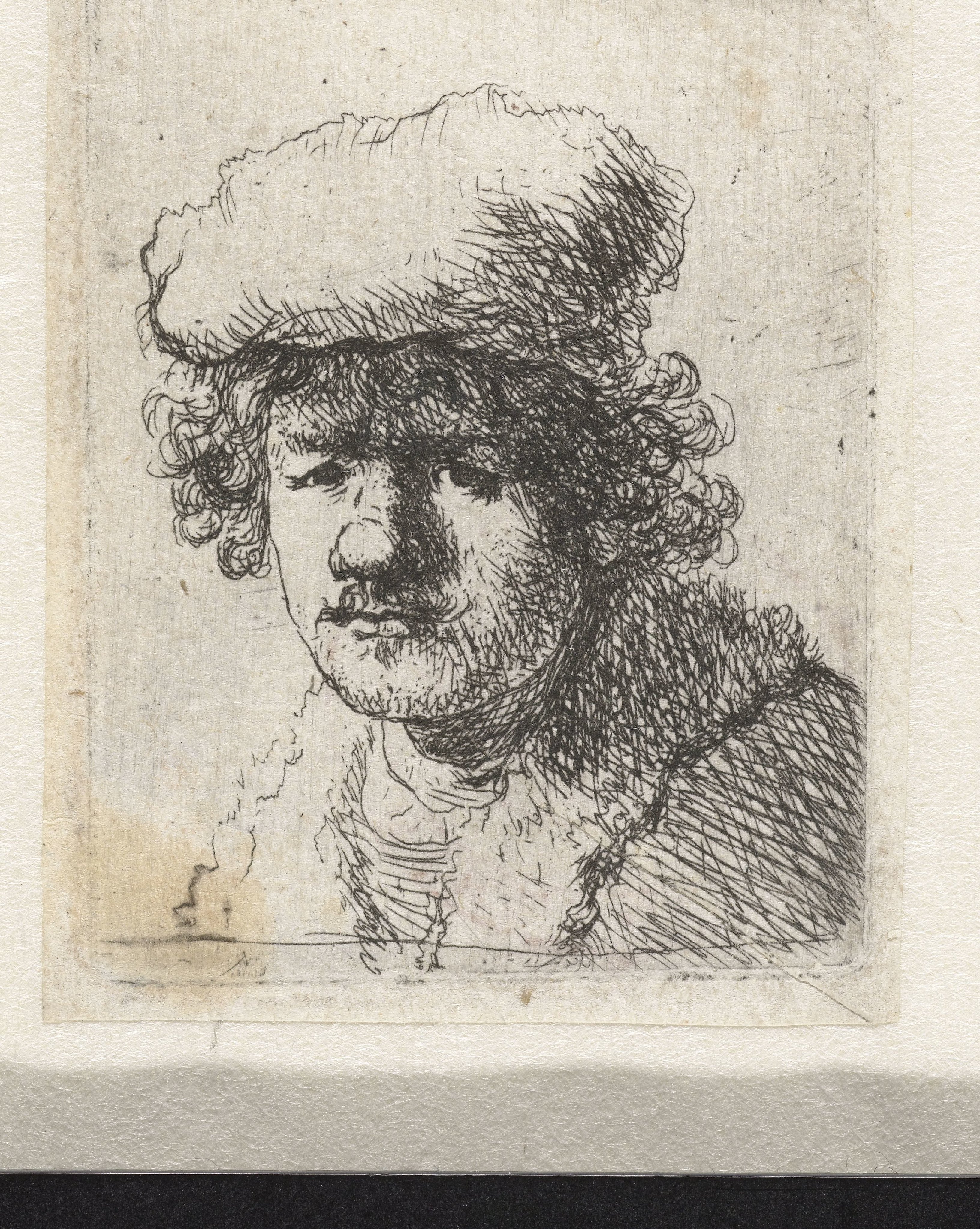 Self-portrait with cap pulled forward