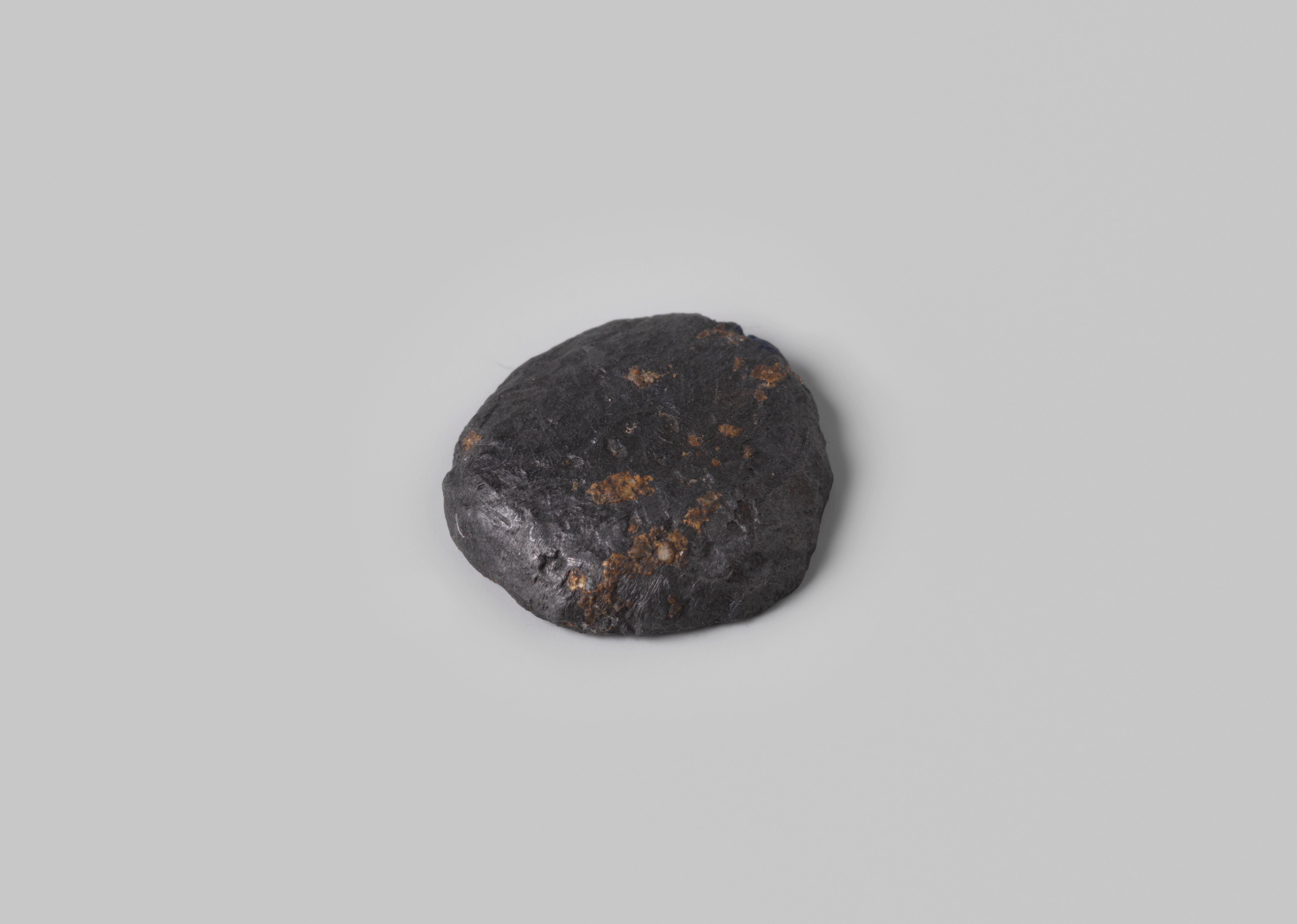Disc shaped weight, lead, from the wreck of the Dutch East India ship Hollandia