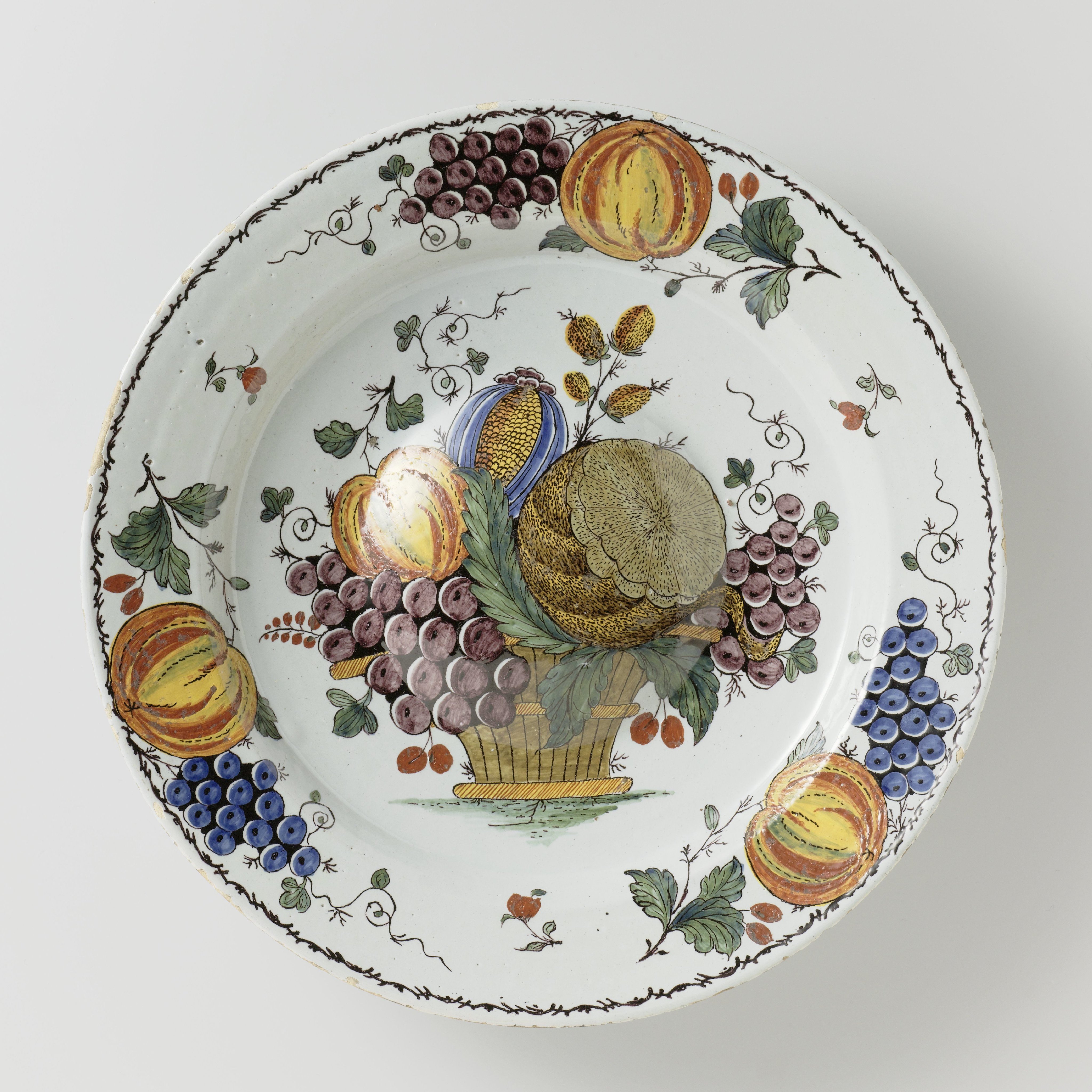 Schotel, beschilderd met een fruitmand